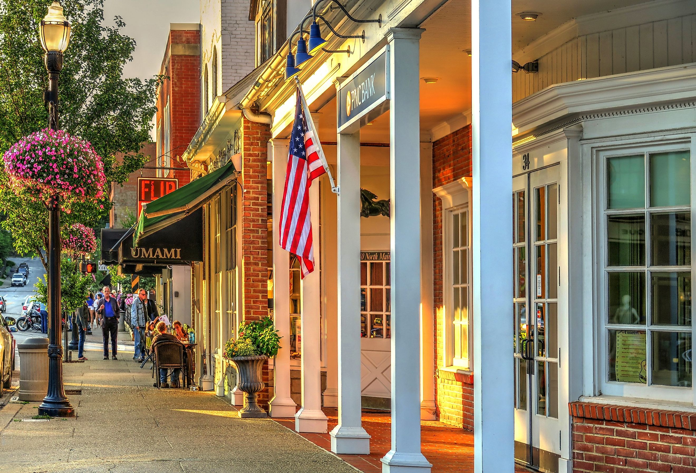 PNC Bank and People Dining on Main Street in July, in Chagrin Falls, Ohio. Image credit Lynne Neuman via Shutterstock