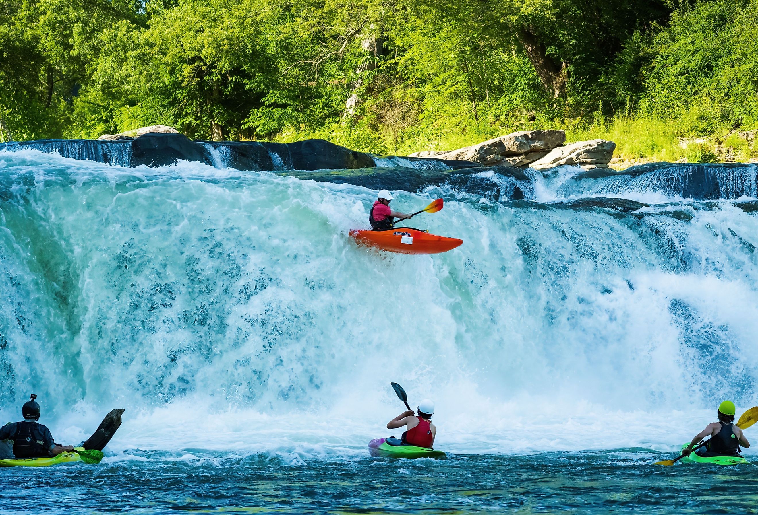 Group of kayakers going over Ohiopyle Falls in Ohiopyle, PA. Image credit Marked Imagery via Shutterstock.