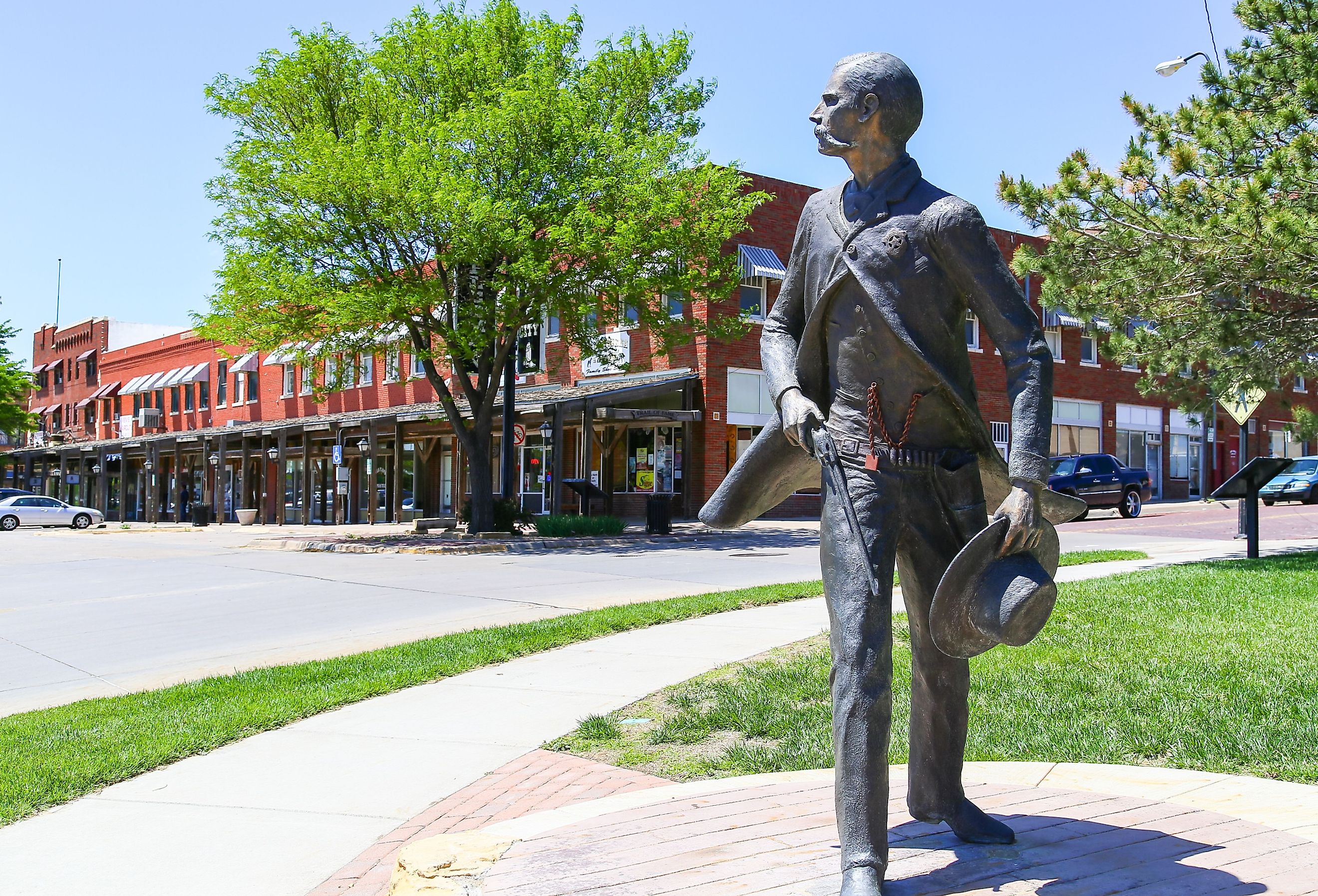 Bronze sculpture of Wyatt Earp as part of the Trail of Fame in the historic district of Dodge City, Kansas. Image credit Michael Rosebrock via Shutterstock