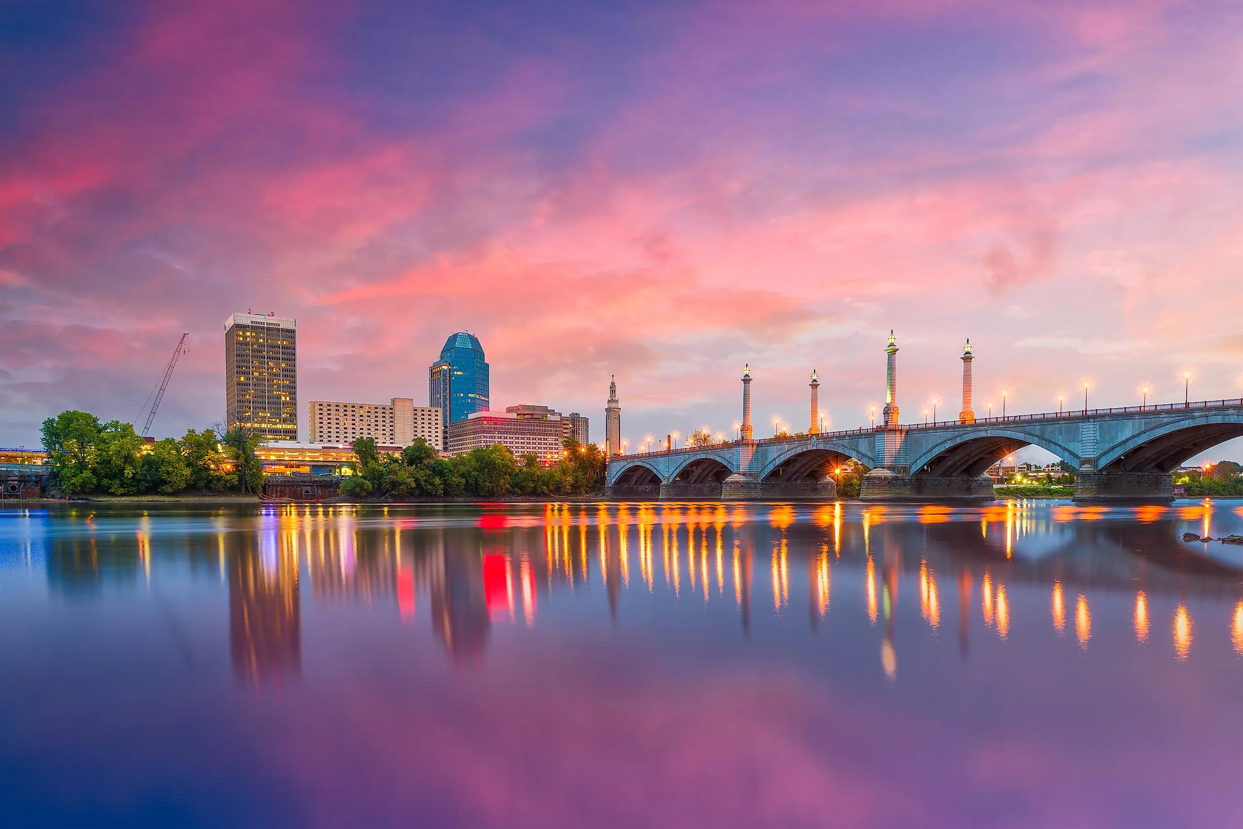 Springfield, Massachusetts, USA, downtown skyline on the river at dusk.