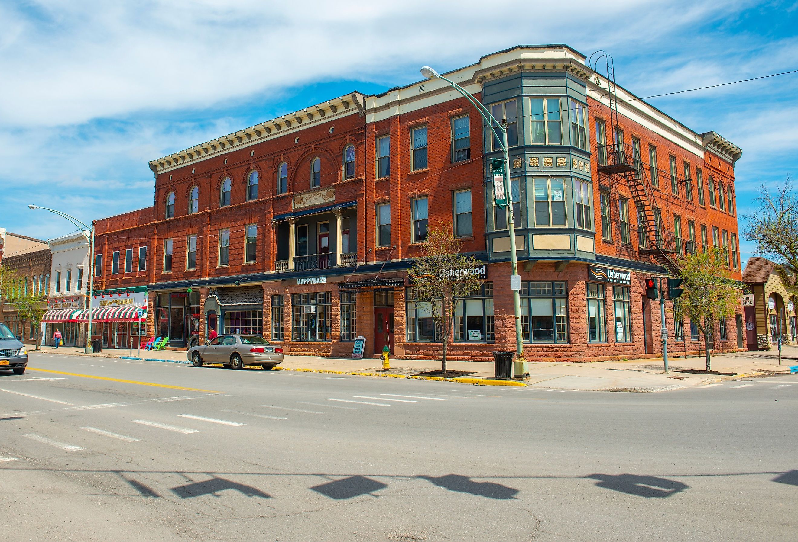 Historic sandstone and brick commercial buildings with Italianate style on Market Street at Main Street in downtown Potsdam, Upstate New York. Image credit Wangkun Jia via Shutterstock