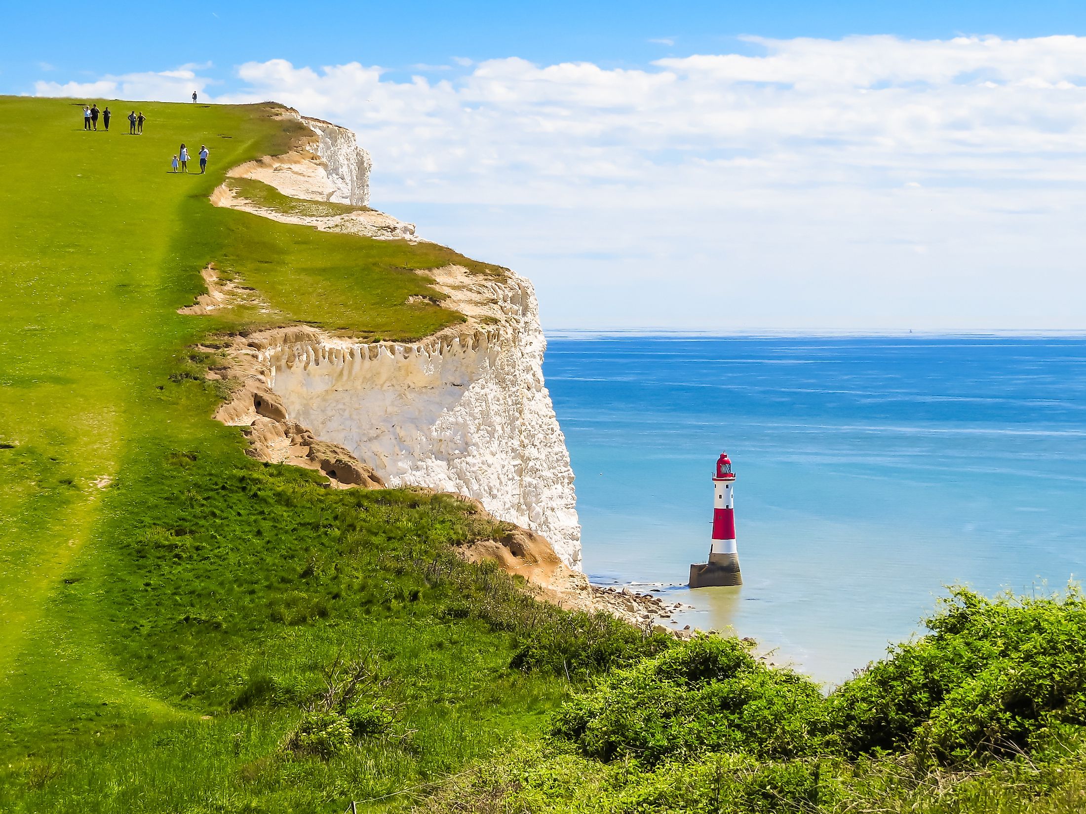 White chalk cliffs and Beachy Head Lighthouse. Eastbourne, East Sussex, England