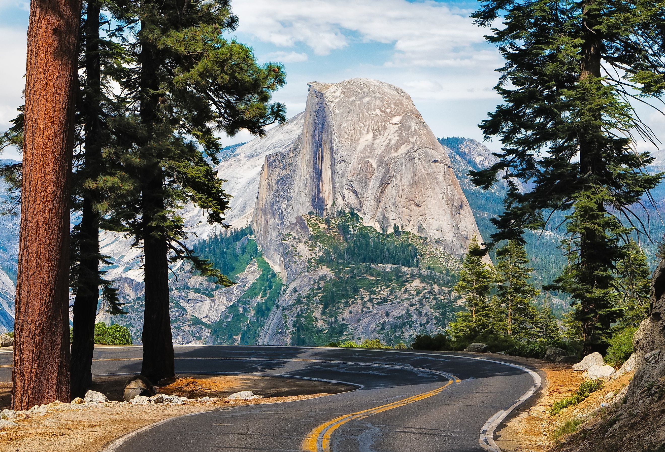 The road leading to Glacier Point in Yosemite National Park, California, USA with the Half Dome in the background. Image credit Tom Nevesely via AdobeStock.