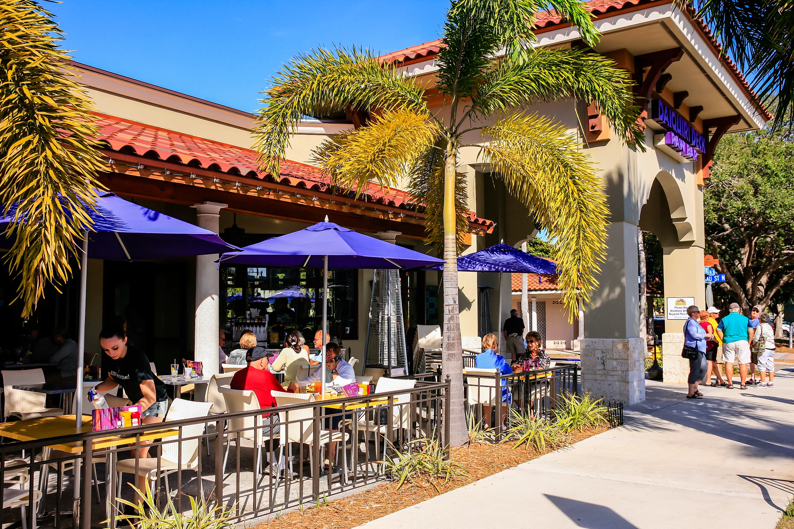 People enjoying an alfresco meal outside a restaurant in downtown Venice, Florida