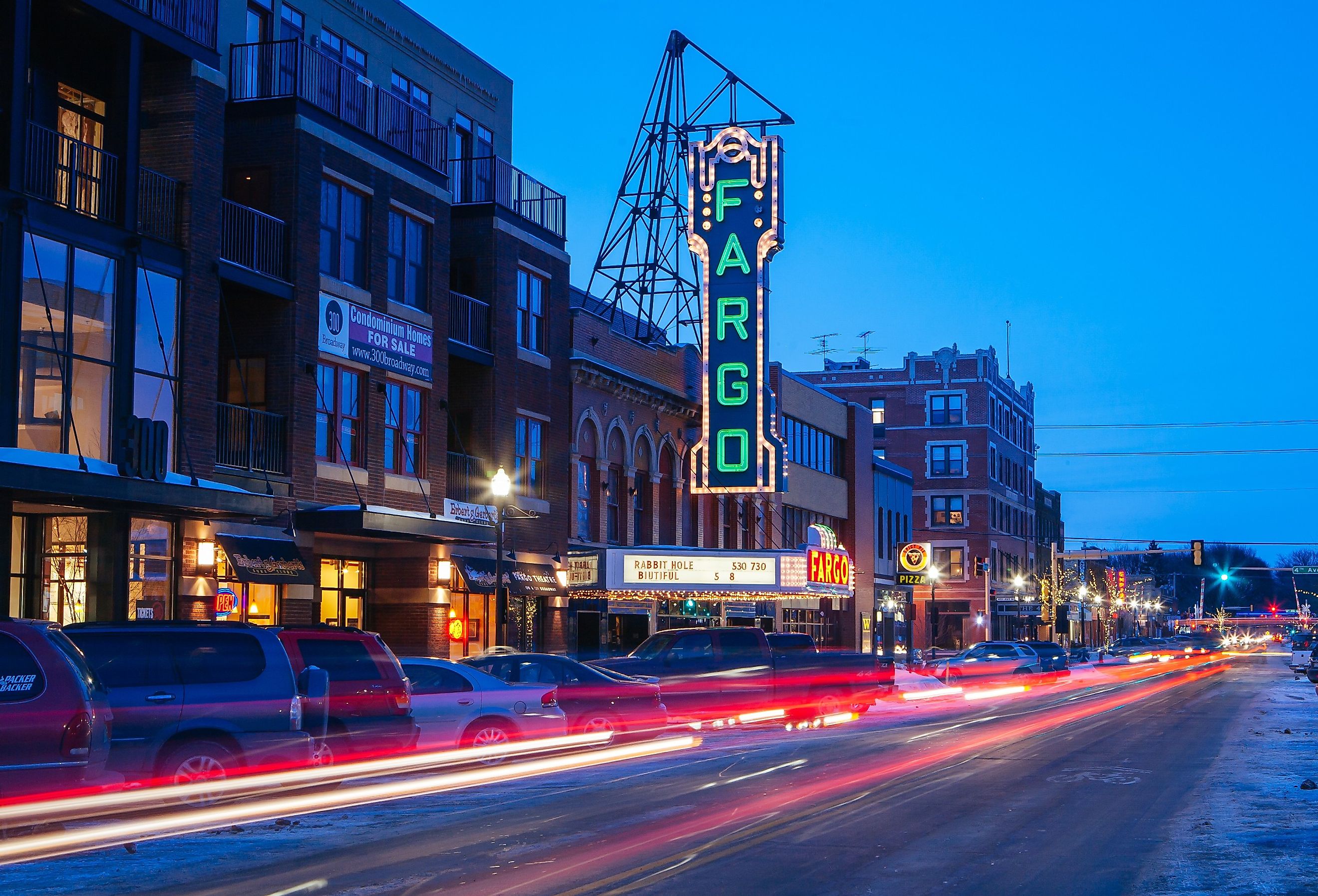 Fargo, North Dakota. Lights on Fargo Theater with street lined with cars. Image credit FiledIMAGE via AdobeStock.