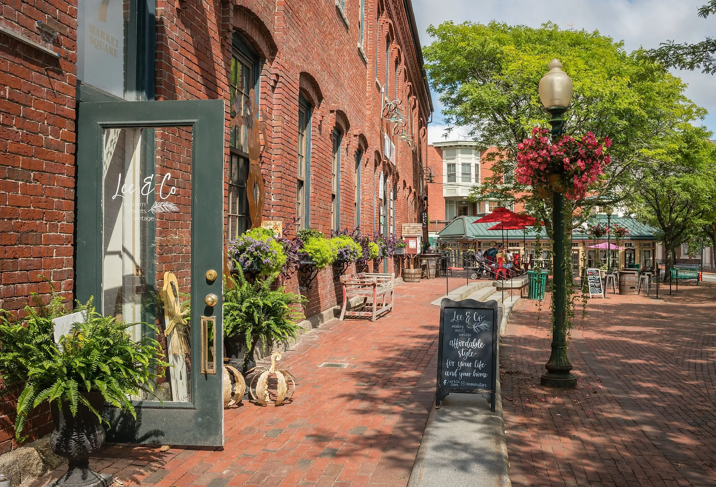 Downtown with historic brick mill buildings and trendy restaurants and charming shops in Amesbury, Massachusetts. Image credit Heidi Besen via Shutterstock