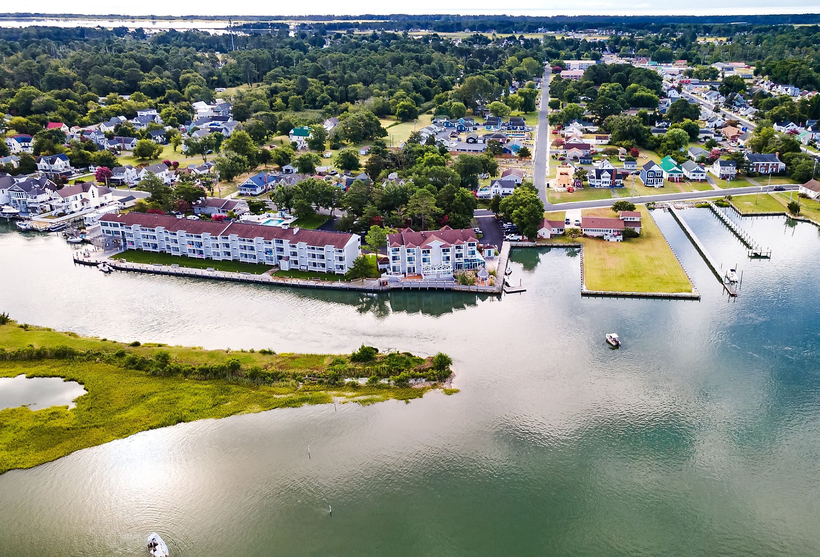 Chincoteague Island, marinas, houses and motels with parking lots.