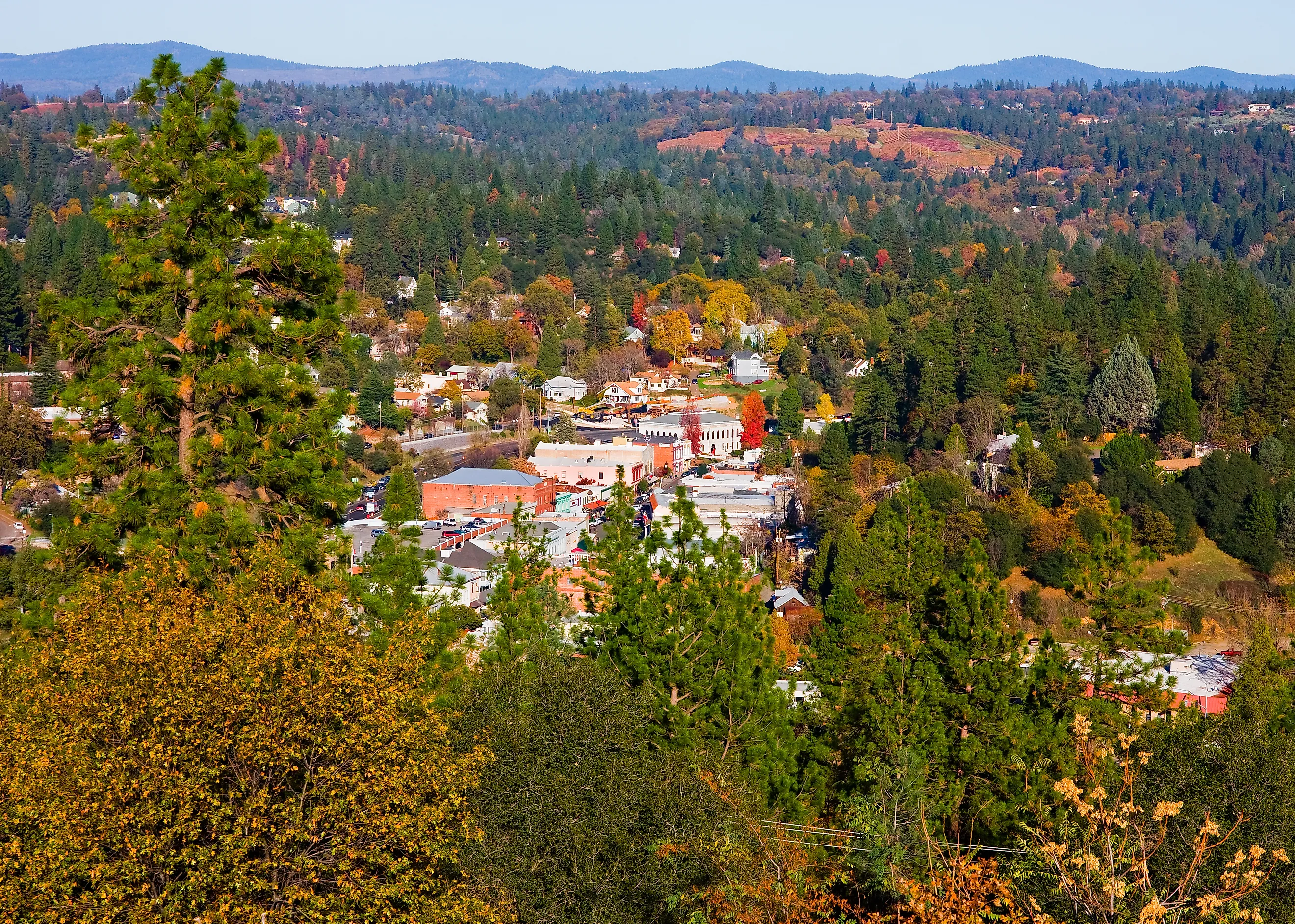 Aerial view of Placerville, California, enveloped in fall foliage.