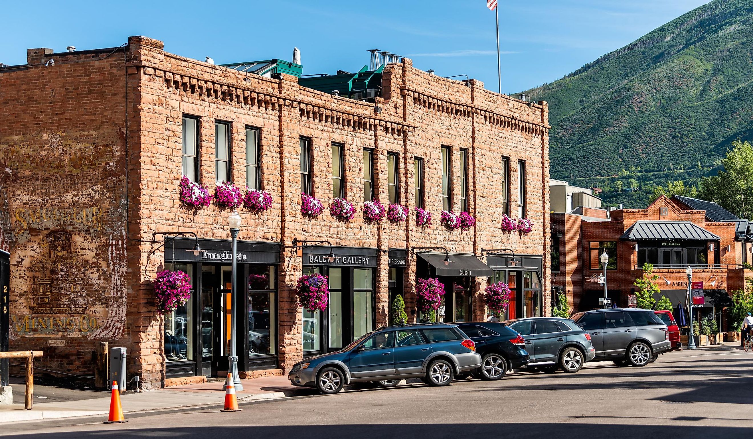 Historic downtown outdoor summer street in Colorado with brick architecture and flower decorations. Editorial Credit: Kristi Blokhin / Shutterstock.com