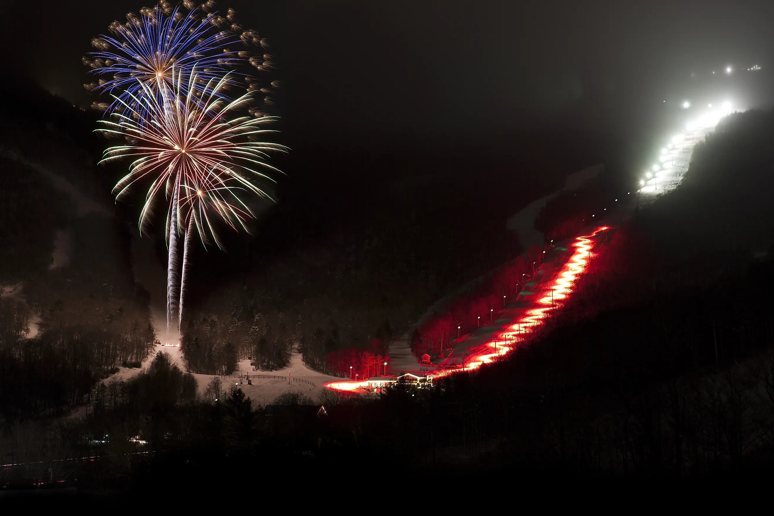Fireworks over Stowe Mountain Resort, Stowe, Vermont, USA.  Via Shutterstock / Don Landwehrle.