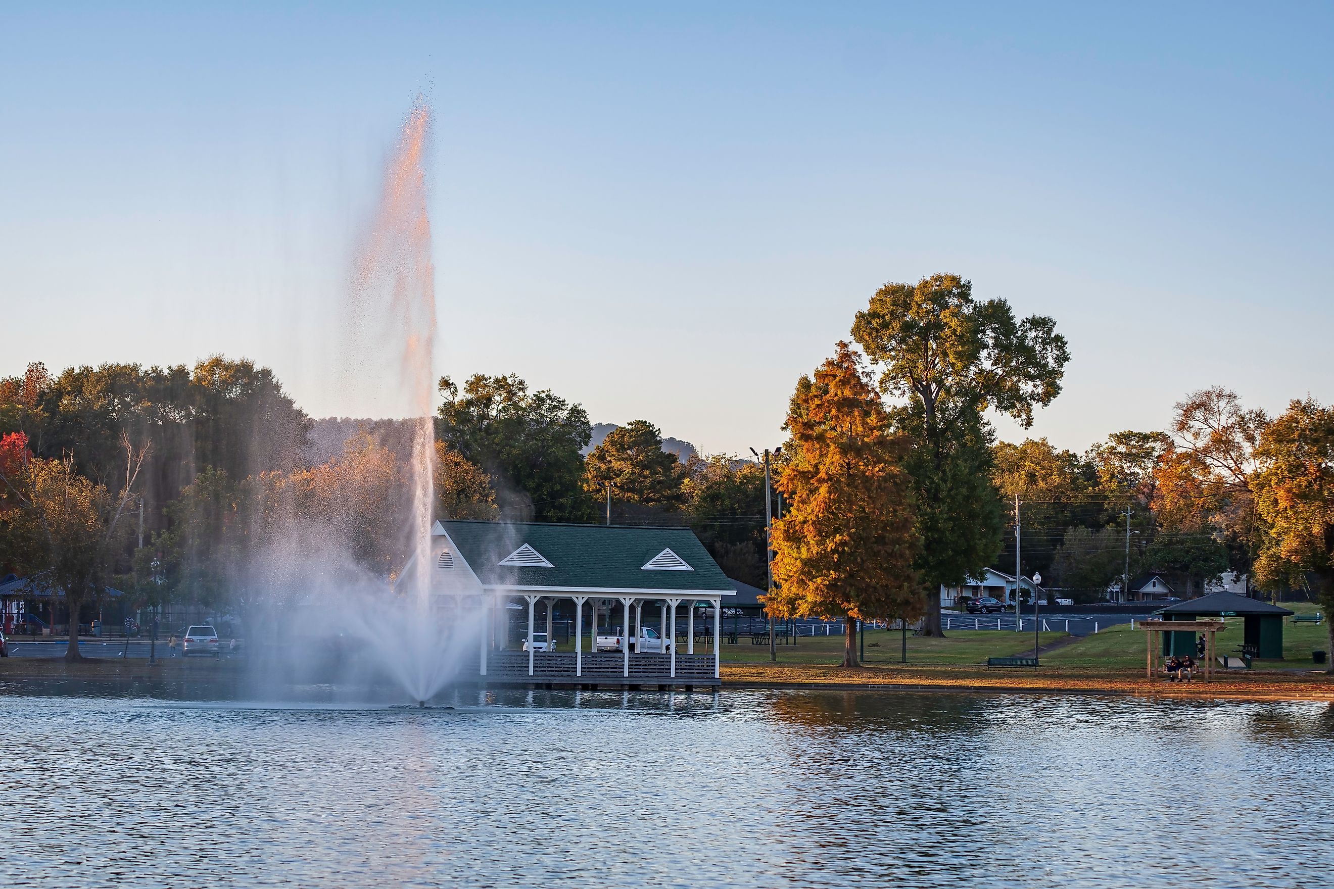 Fountain and gazebo in late afternoon at Oxford Lake Park in Oxford, Alabama. Image credit: JNix / Shutterstock.com.