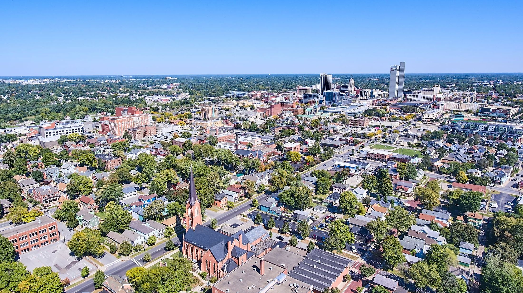 Aerial view of Fort Wayne, Indiana with church in the front and downtown in background. 