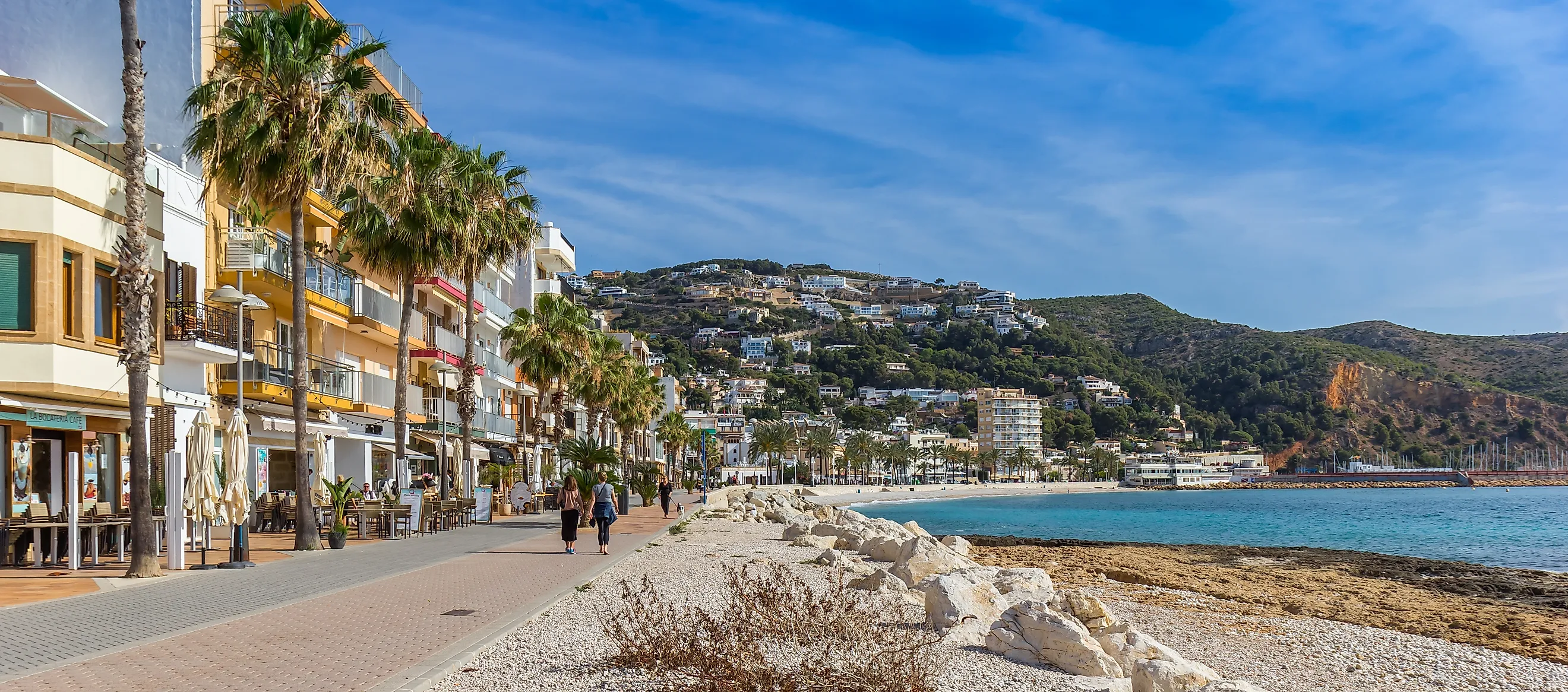 Panorama of the seaside boulevard with bars and restaurants in Javea, Spain. (Image Credit: Marc Venema via Shutterstock.com)