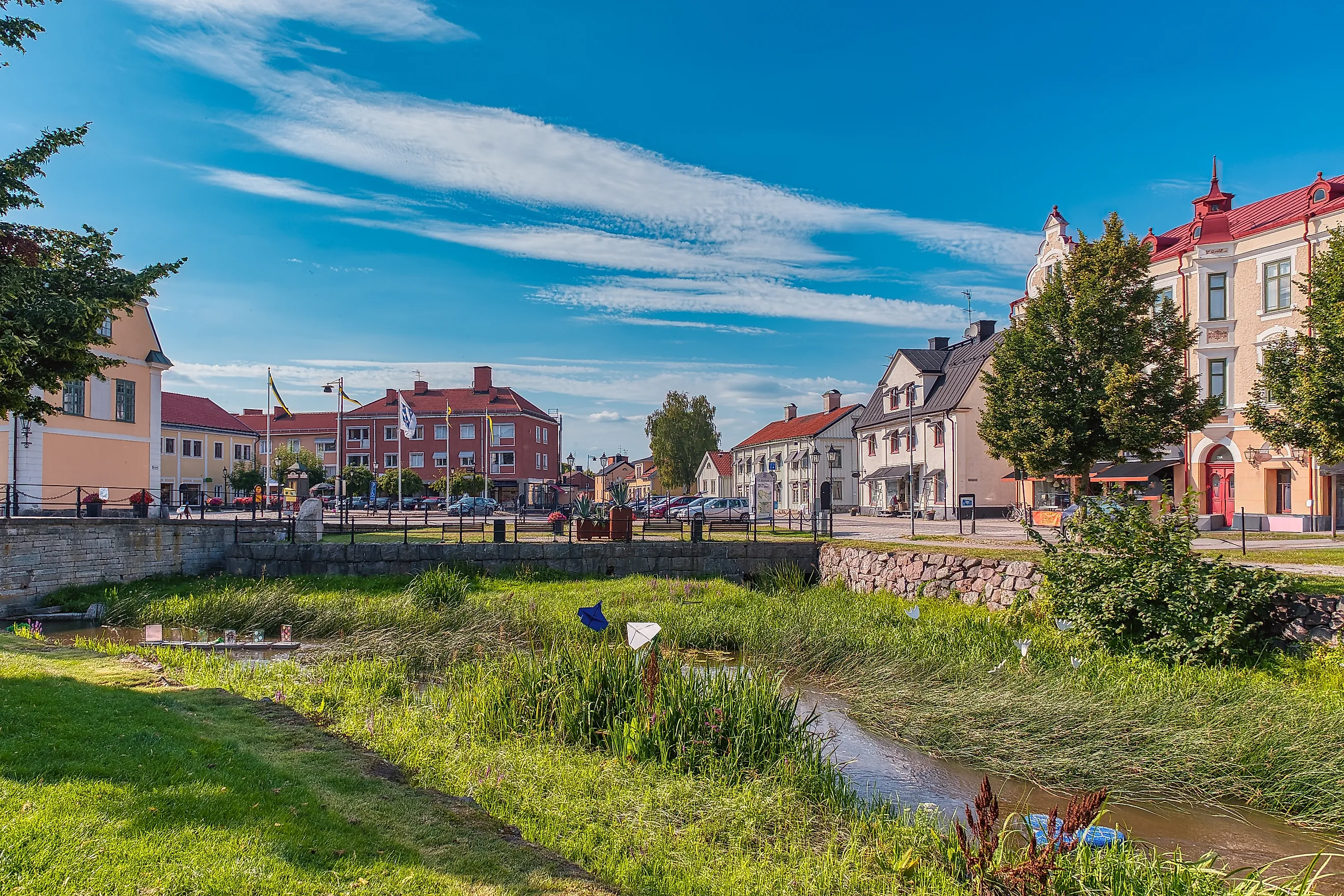 Looking across the Söderköpingsån at buildings along Storgatan in Söderköping, Sweden.