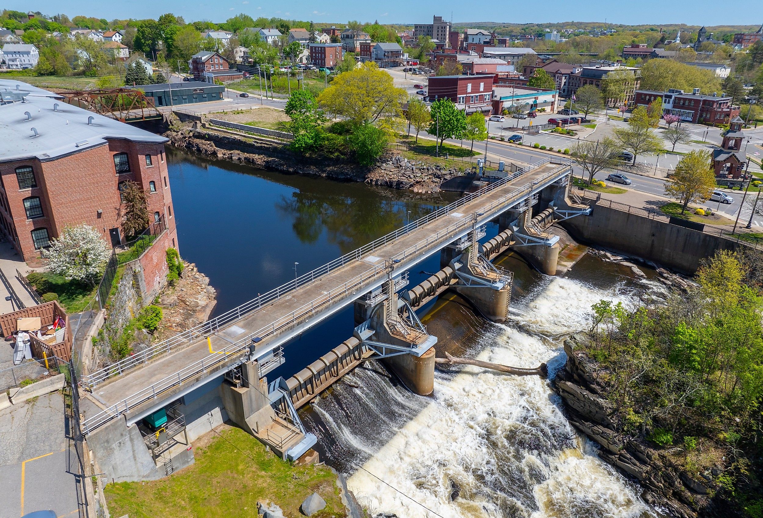Woonsocket Falls Dam and Glenark Mills building on Blackstone River aerial view in downtown Woonsocket, Rhode Island.