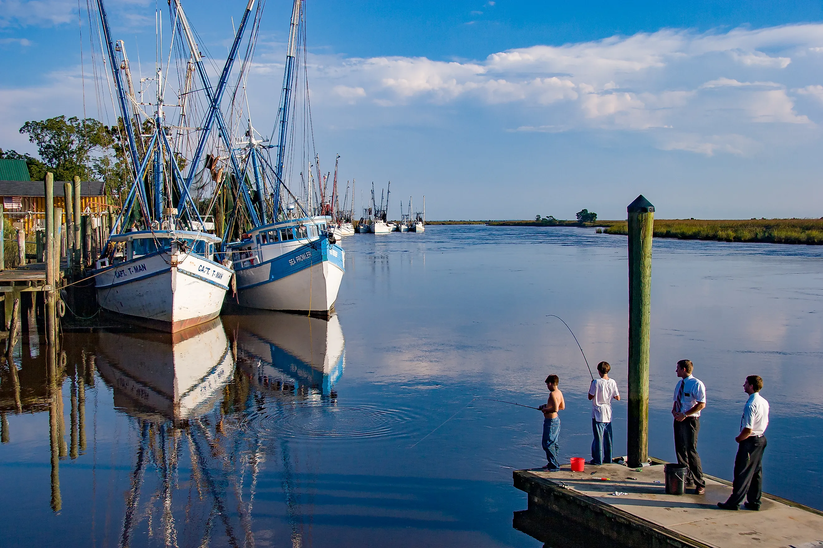Two boys fishing in Darien, Georgia. Image credit Bob Pool via Shutterstock