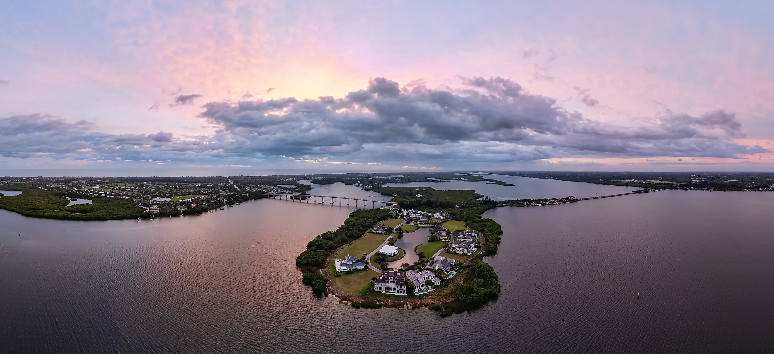 Panoramic aerial view of the Indian River Lagoon at sunrise with Wabasso Island and the Vero Beach coastline in Florida.