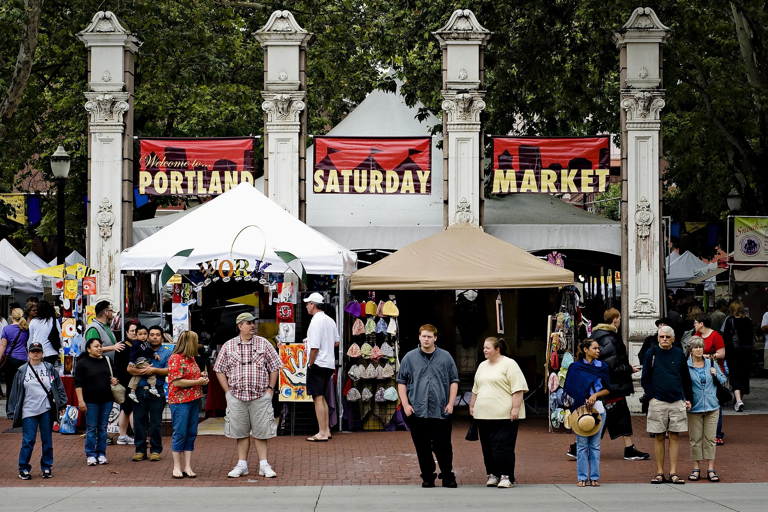 Portland Saturday market is full with visitors that are buying craft and art products o, in Portland, Oregon, via Ziga Cetrtic / Shutterstock.com