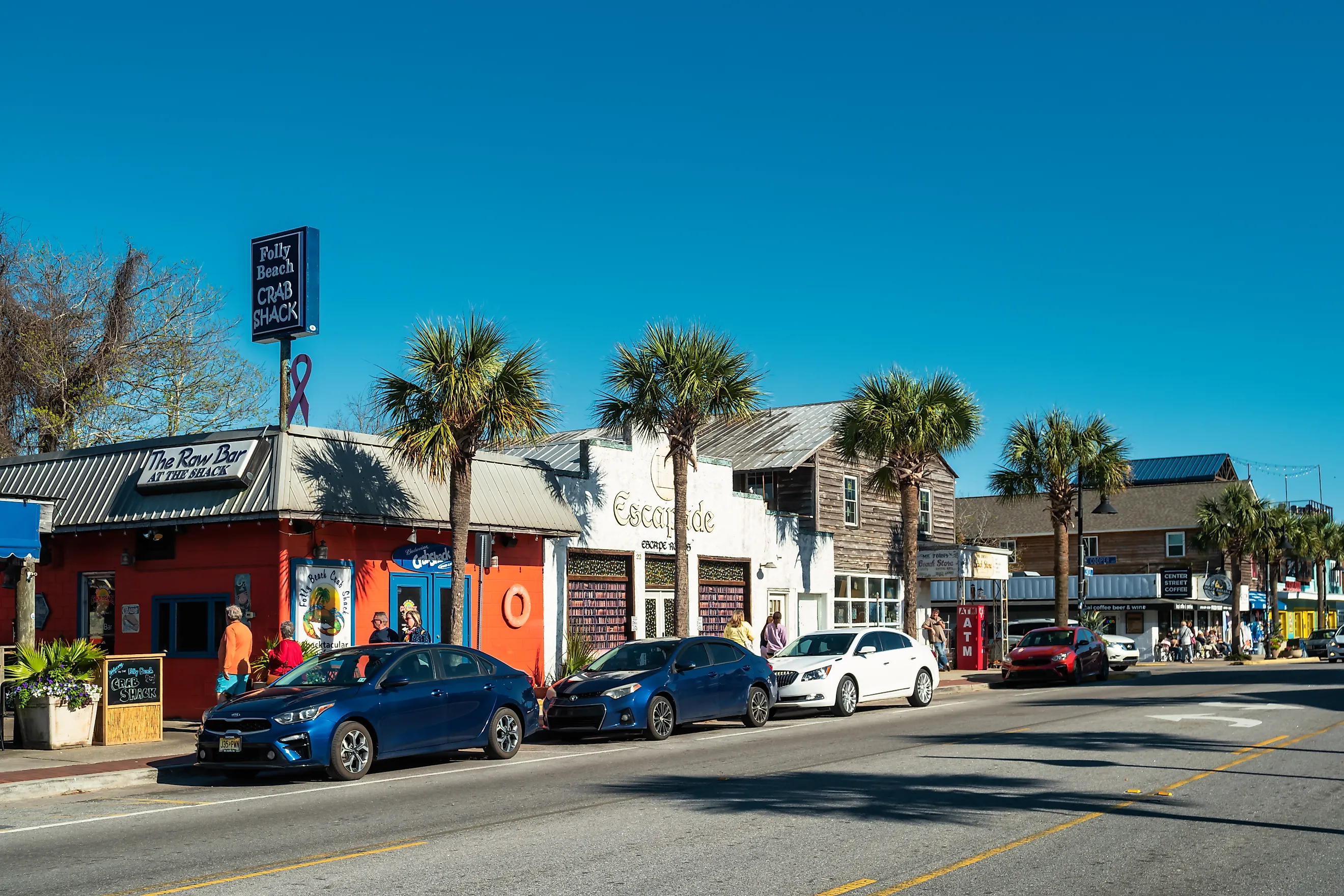 Pedestrians walk in downtown Folly Beach, South Carolina
