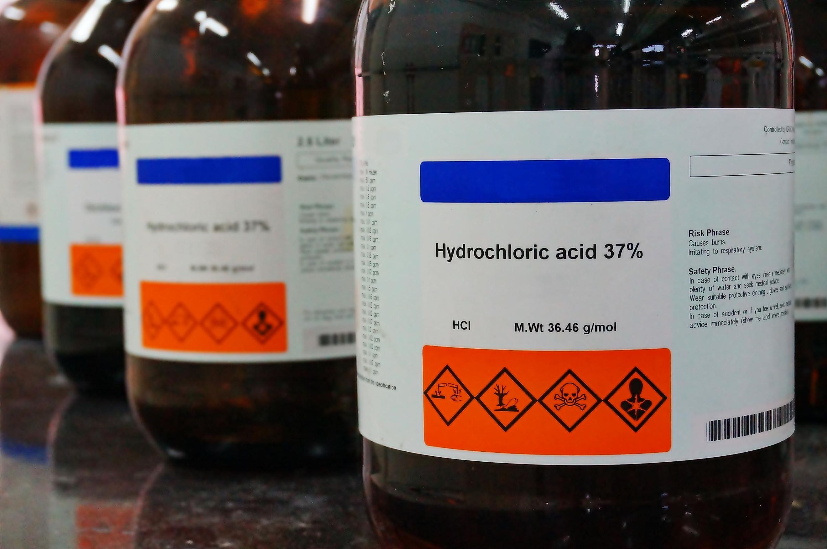 A bottle of hydrochloric acid, also called muriatic acid.