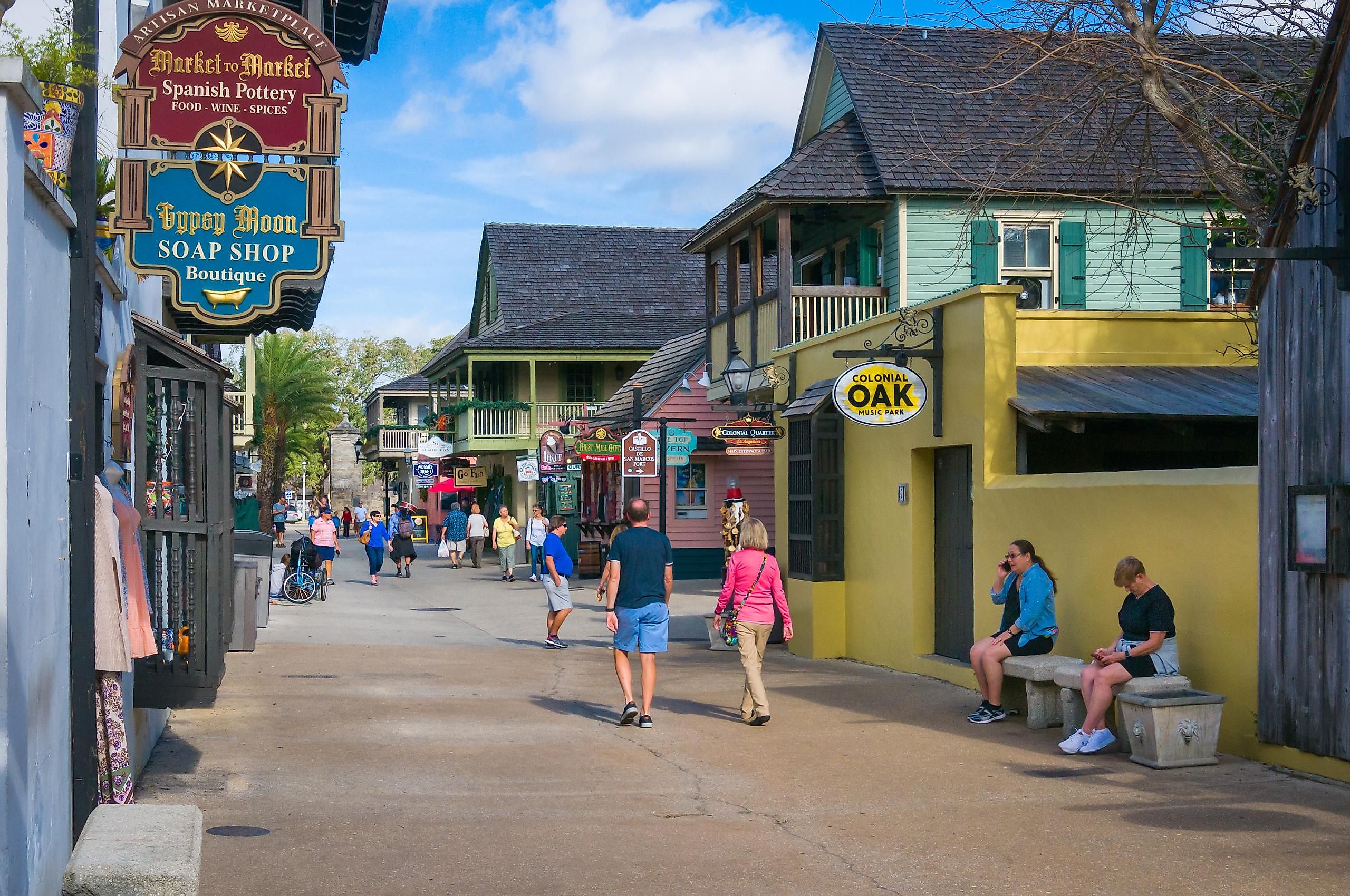 A few tourists walk along St. George street in St. Augustine, Florida, via KenWiedemann / iStock.com