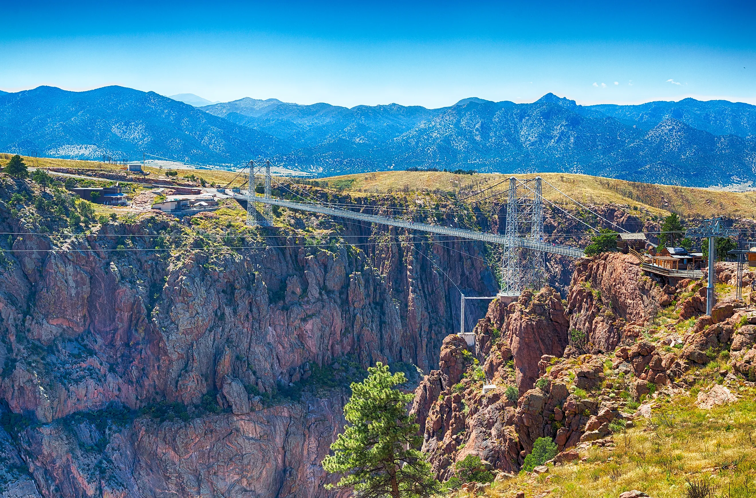 Royal gorge canyon and the associate suspension bridge draw tourists to Colorado. 