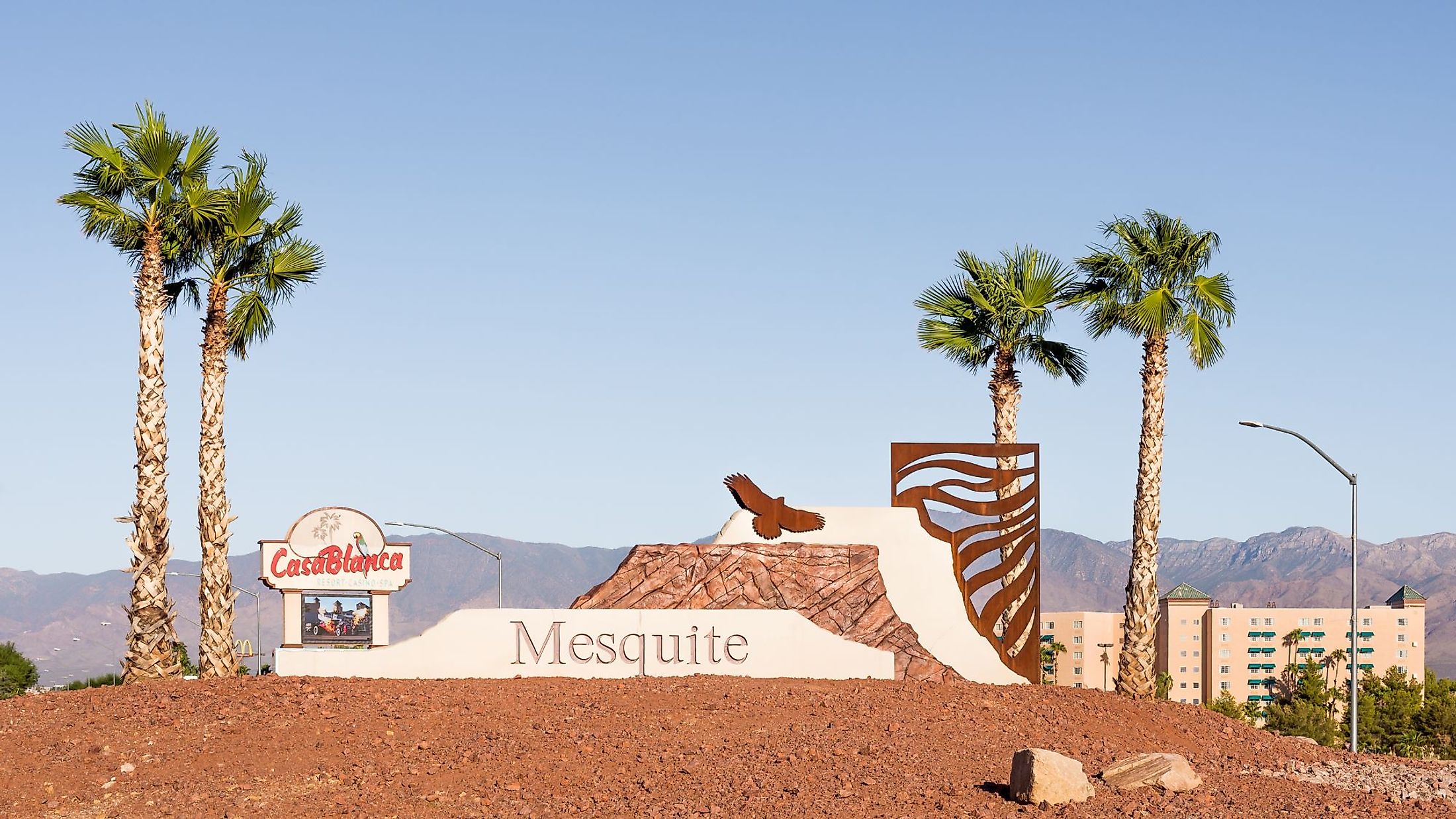 A Mesquite, Nevada welcome sculpture and palm trees fronts the Casa Blanca Resort & Casino. Editorial credit: Steve Lagreca / Shutterstock.com