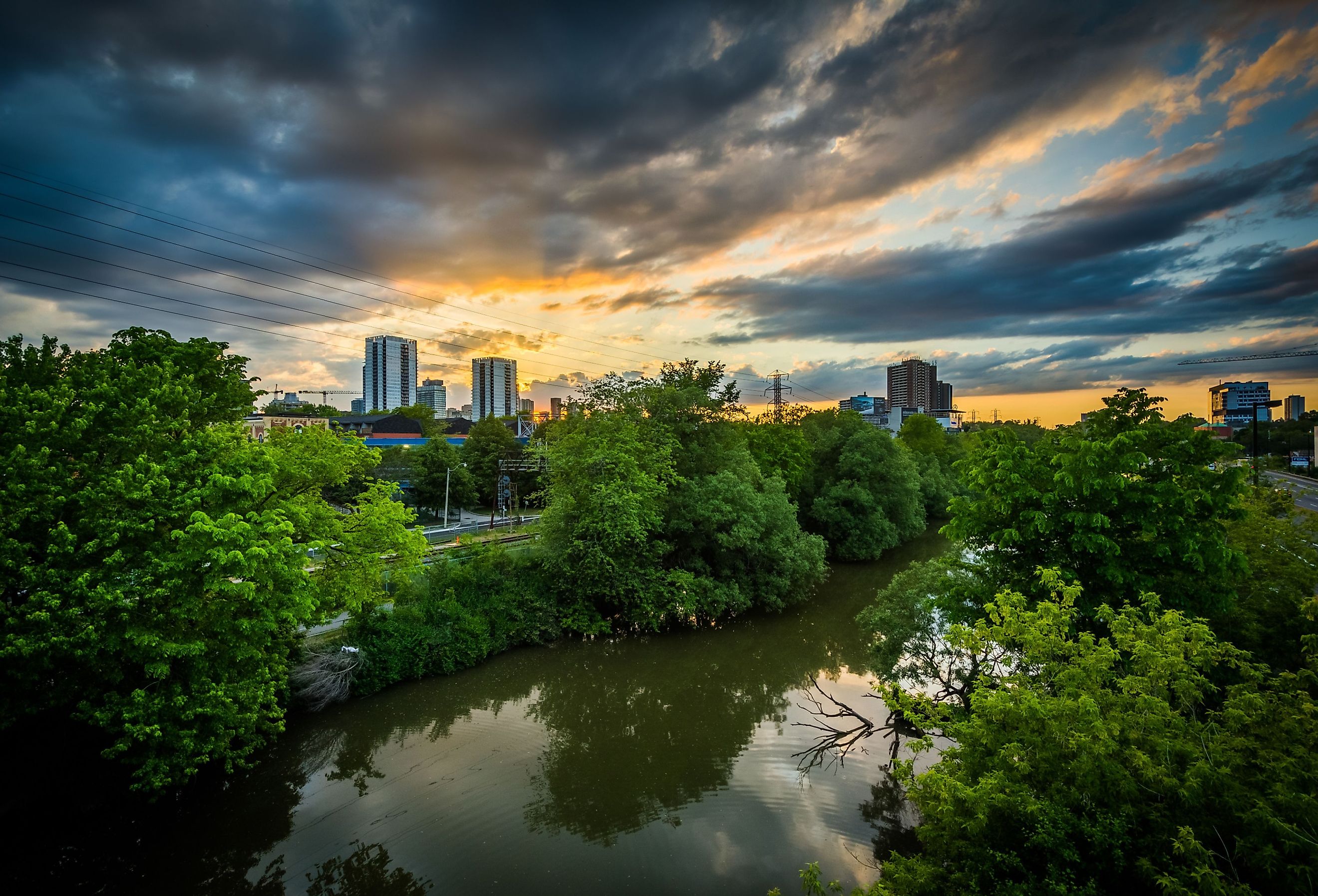 Sunset over the Lower Don River, in Toronto, Ontario. Image credit Jon Bilous via Shutterstock.