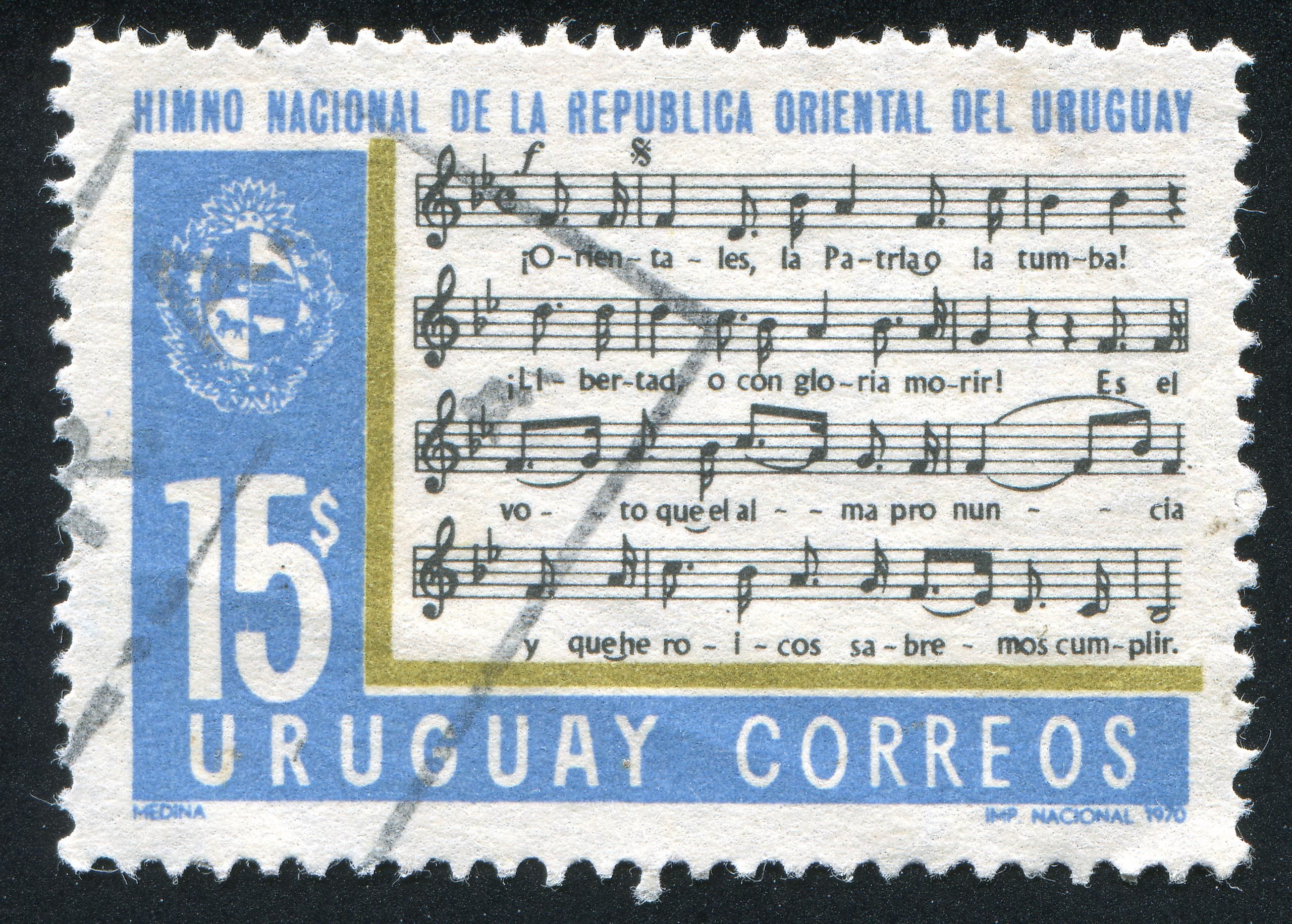 A stamp printing in Uruguay showing a section of the national anthem. Editorial credit: rook76 / Shutterstock.com.