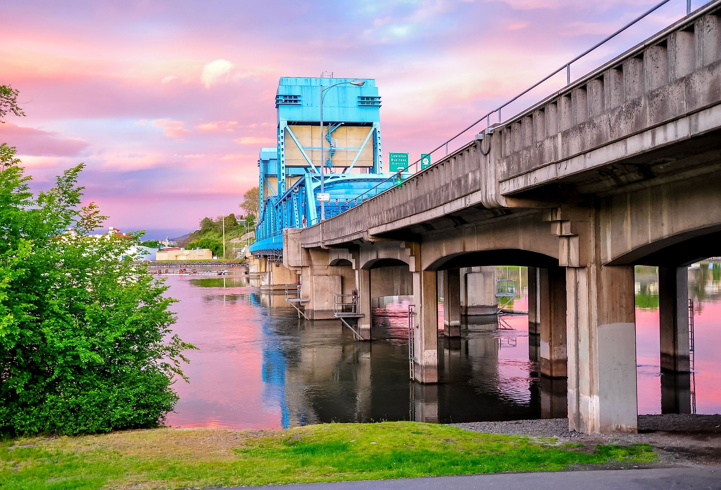 Historic Lewiston's Clarkston blue bridge against a pink sunset.
