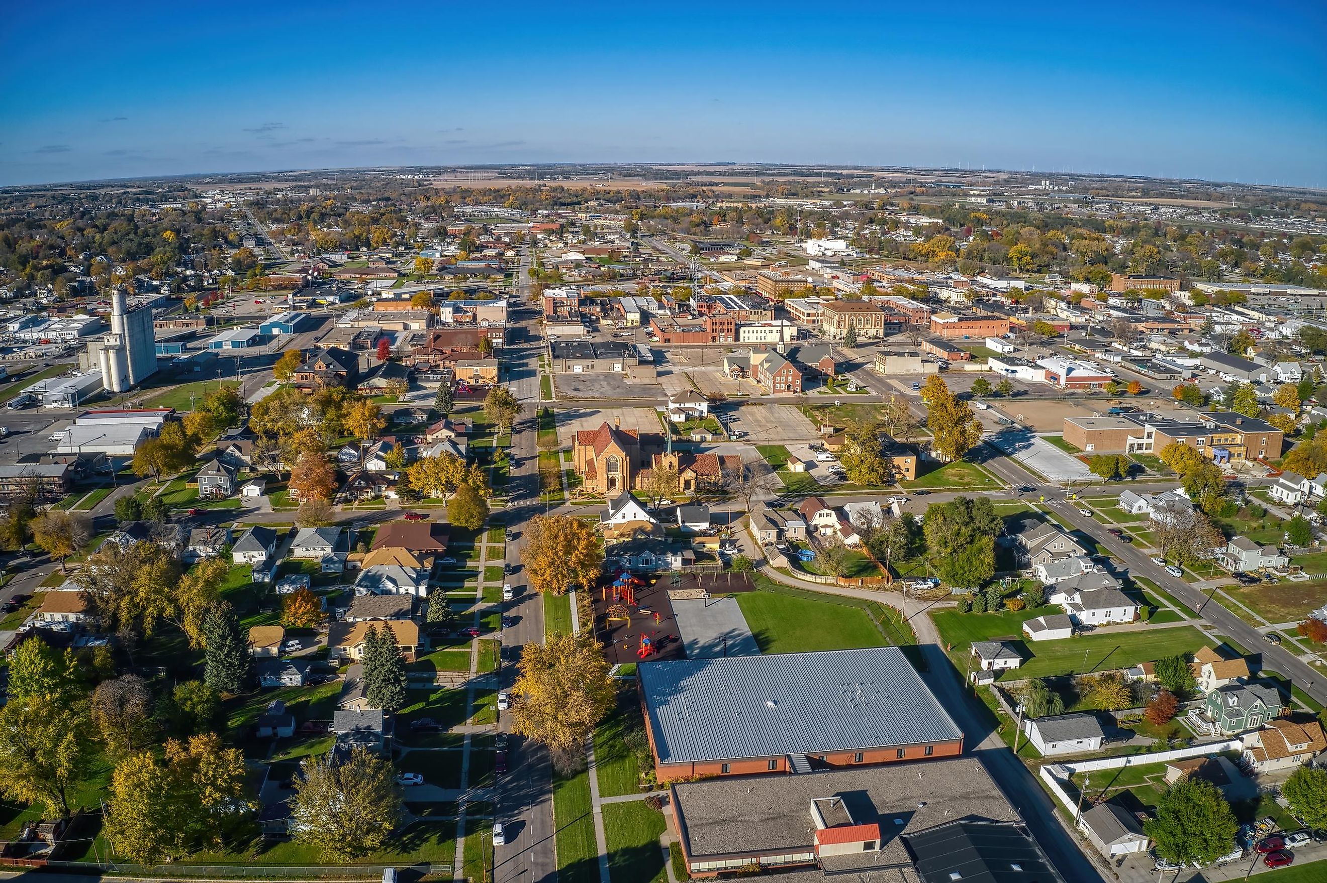 Aerial perspective of downtown Norfolk, Nebraska during the autumn season.