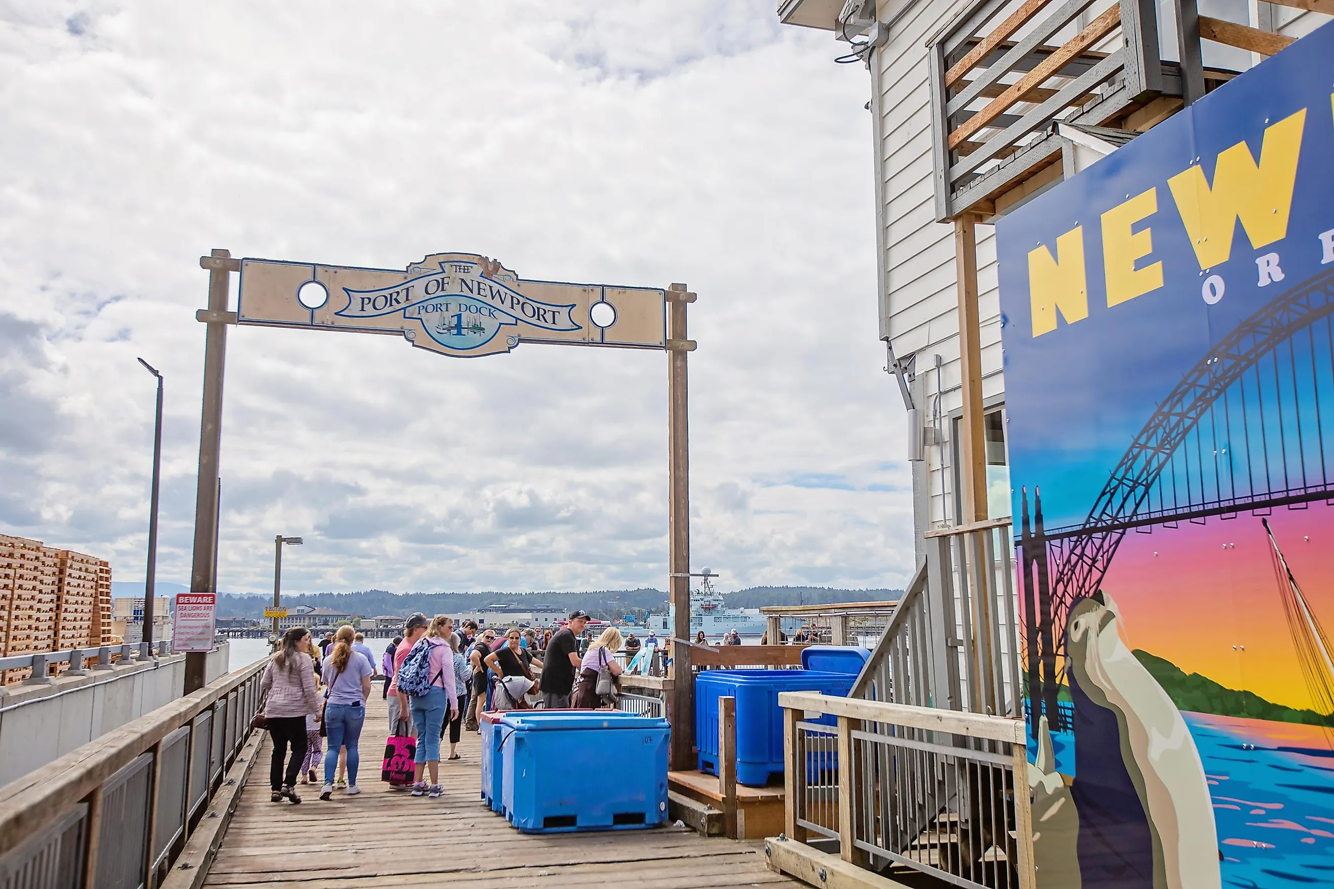 People visit a main attraction in waterfront Newport, Oregon - the Sea Lion Docks.