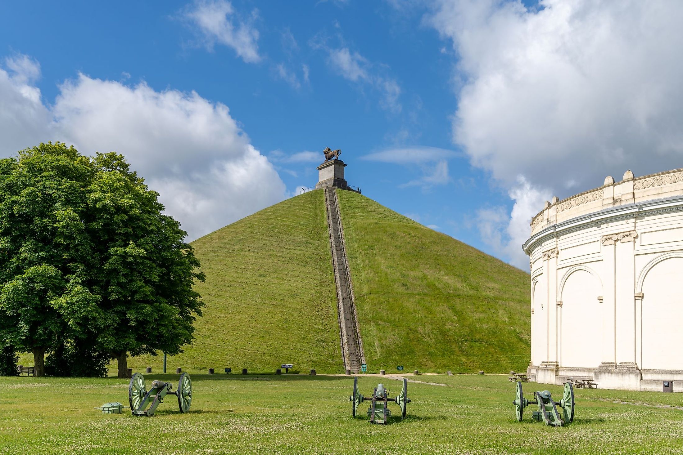 View of the Lion's Mound and cannons at the Waterloo Battlefield Memorial outside of Brussels, Belgium. Editorial credit: makasana photo / Shutterstock.com