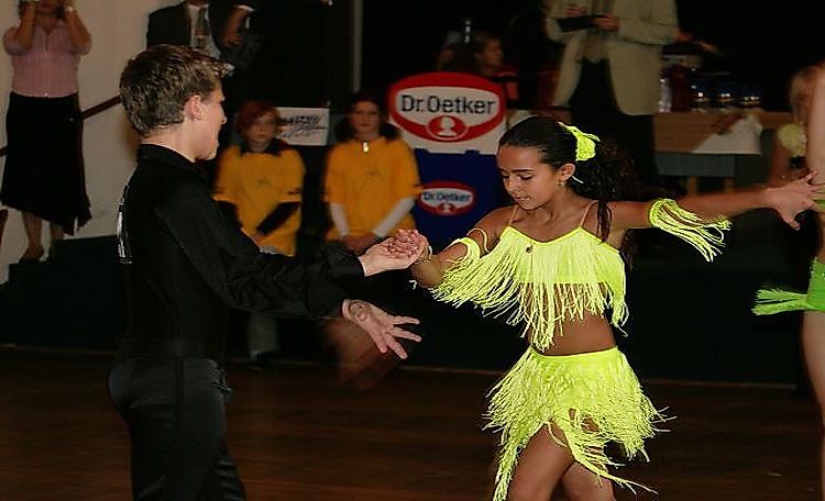 A Cha-cha dancing pair at a junior ballroom dance competition in Tuchlovice, Czech Republic.