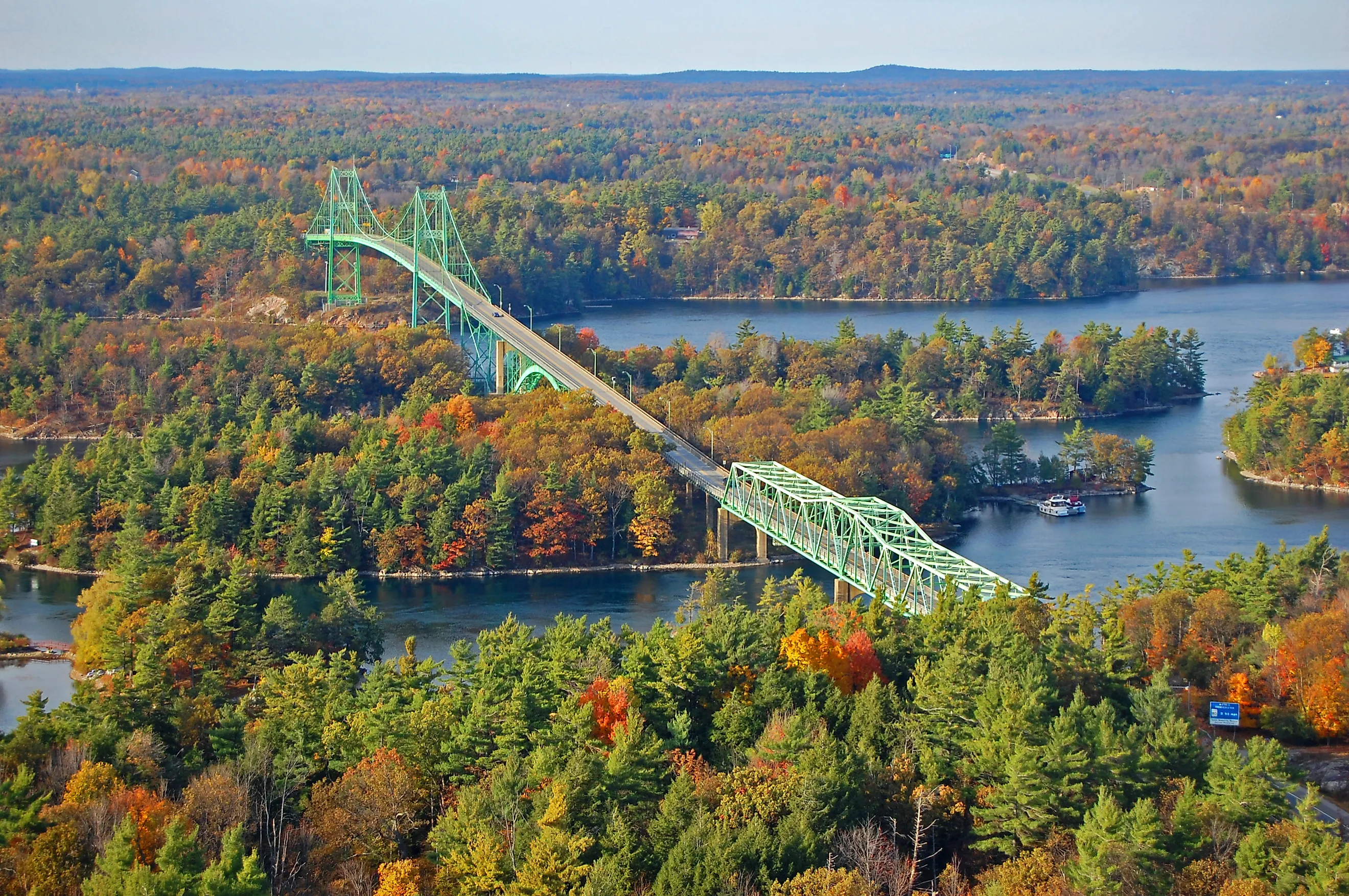 Thousand Islands Bridge across St. Lawrence River in fall in Thousand Islands National Park.