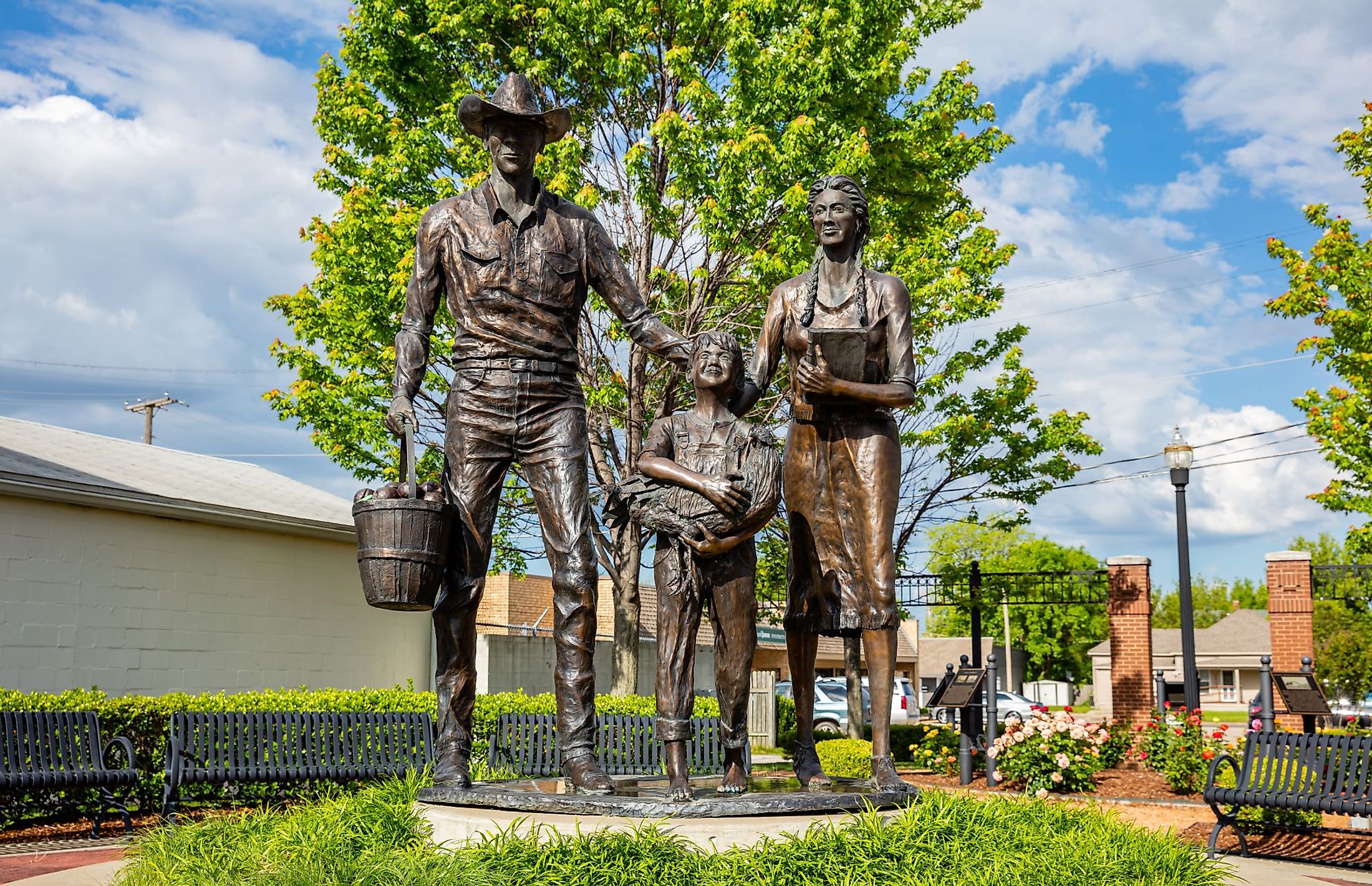 Bronze statue of an early 20th century agriculture family at Centennial Park on Main Street in Broken Arrow, Tulsa, Oklahoma. Editorial credit: rawf8 / Shutterstock.com