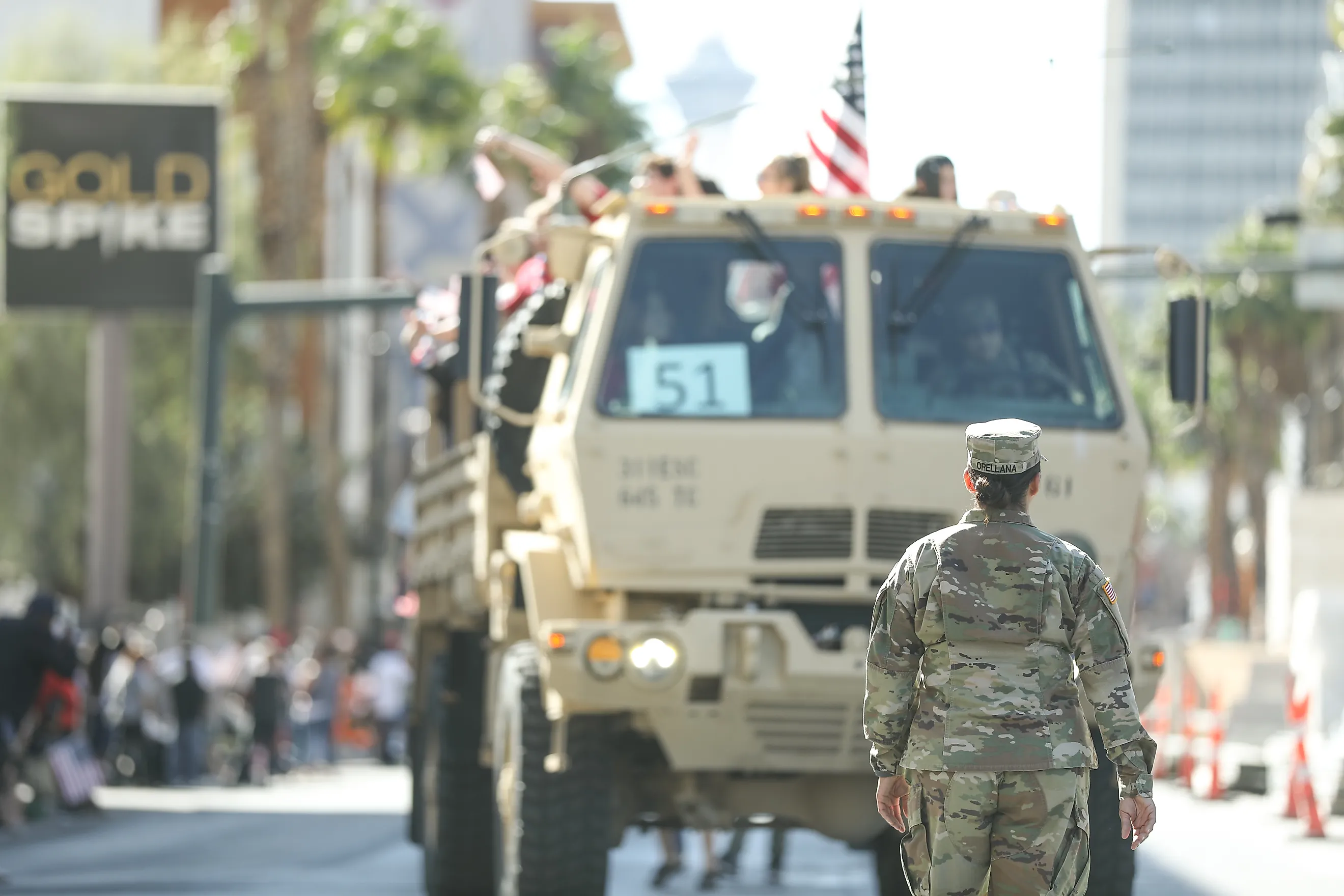  A female soldier of the US Army standing in front of a truck in the Veteran’s Day Parade. Editorial credit: RYO Alexandre / Shutterstock.com
