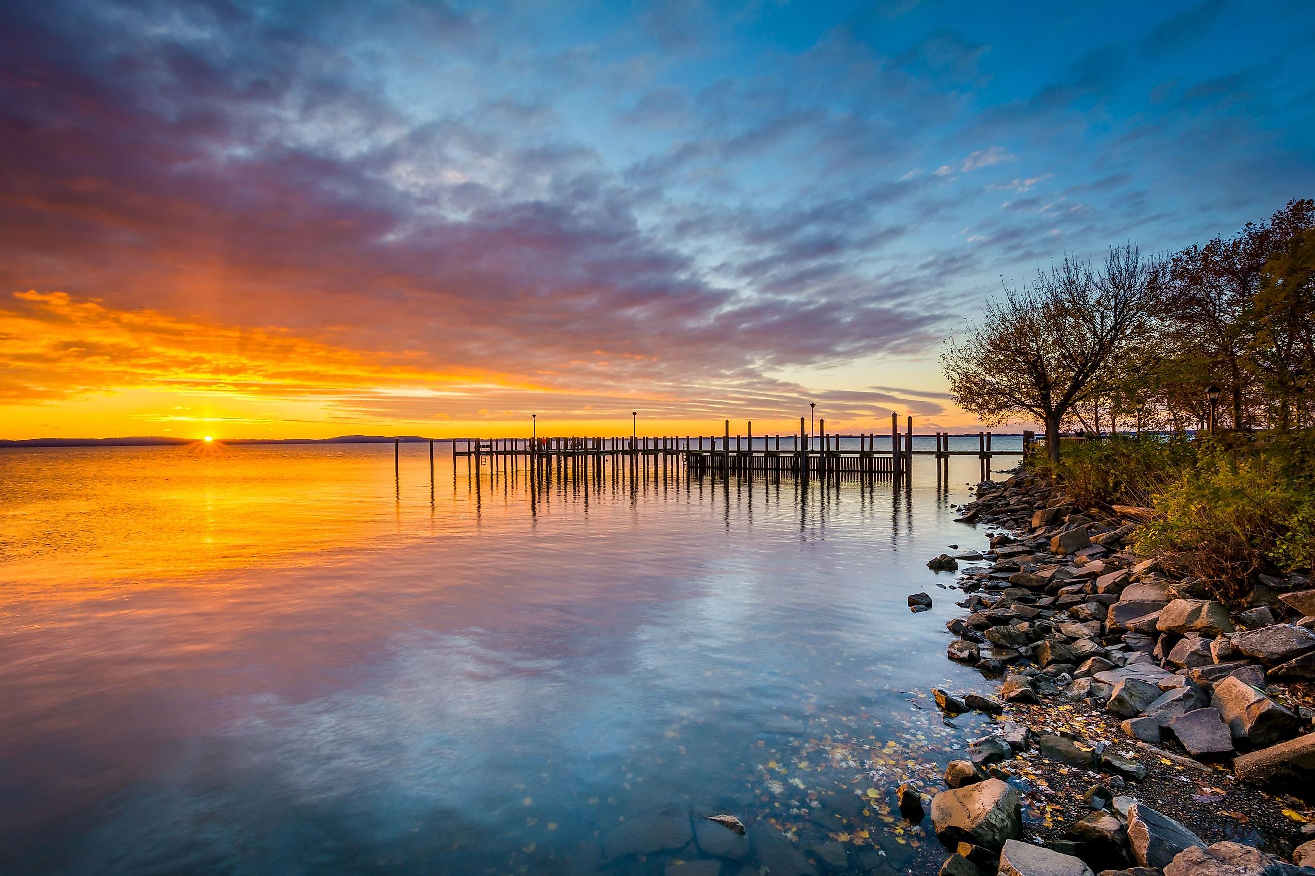 Sunrise over dock and the Chesapeake Bay, in Havre de Grace, Maryland.