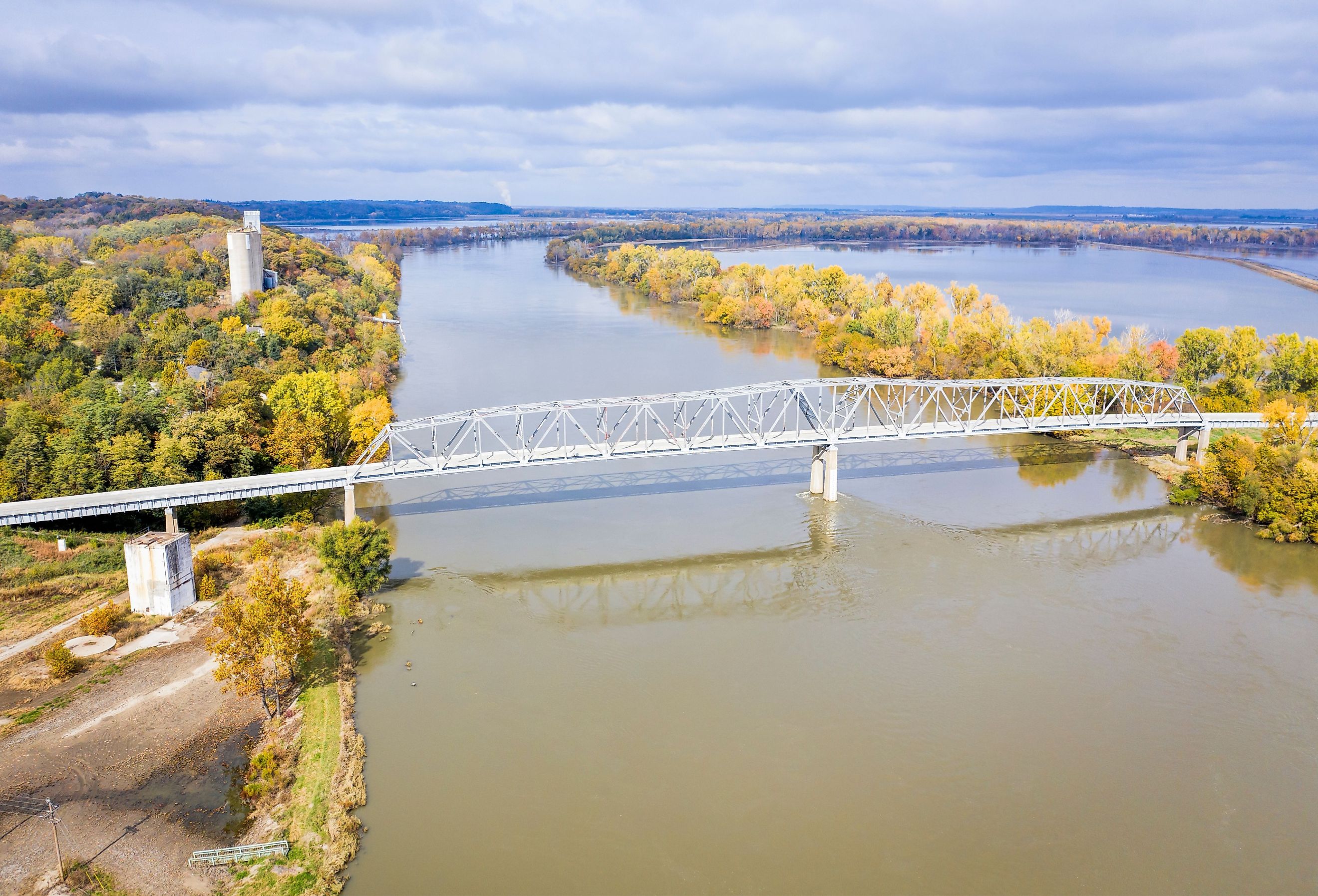 Aerial view in fall scenery with flooded river and Brownville Bridge over the Missouri River at Brownville, Nebraska.