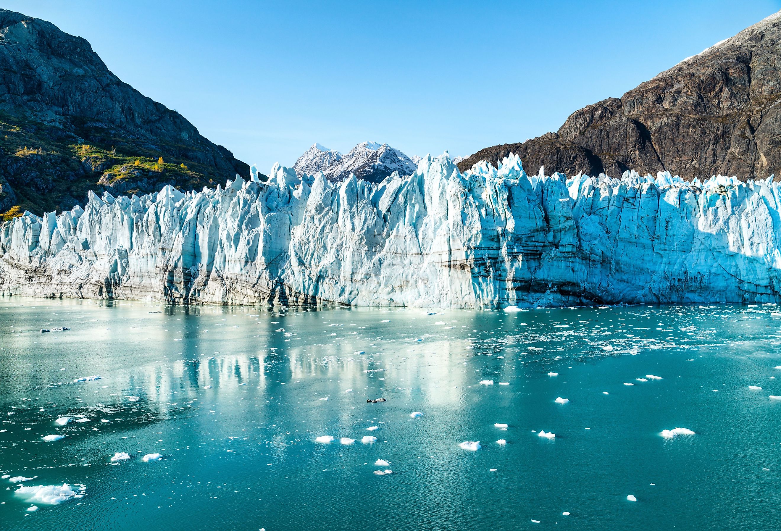Alaska Glacier Bay landscape view from cruise ship holiday travel. Image credit Maridav via Shutterstock.