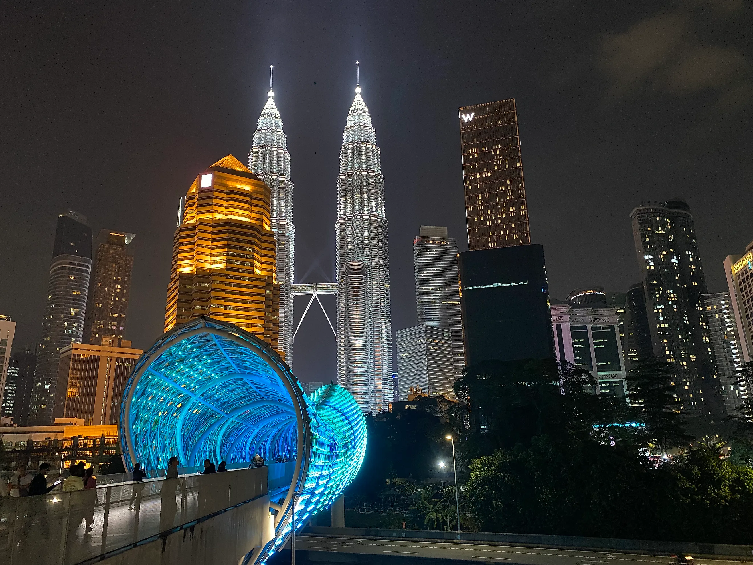The iconic Petronas Twin Towers light up Kuala Lumpur’s skyline. Photo credit: Andrew Douglas