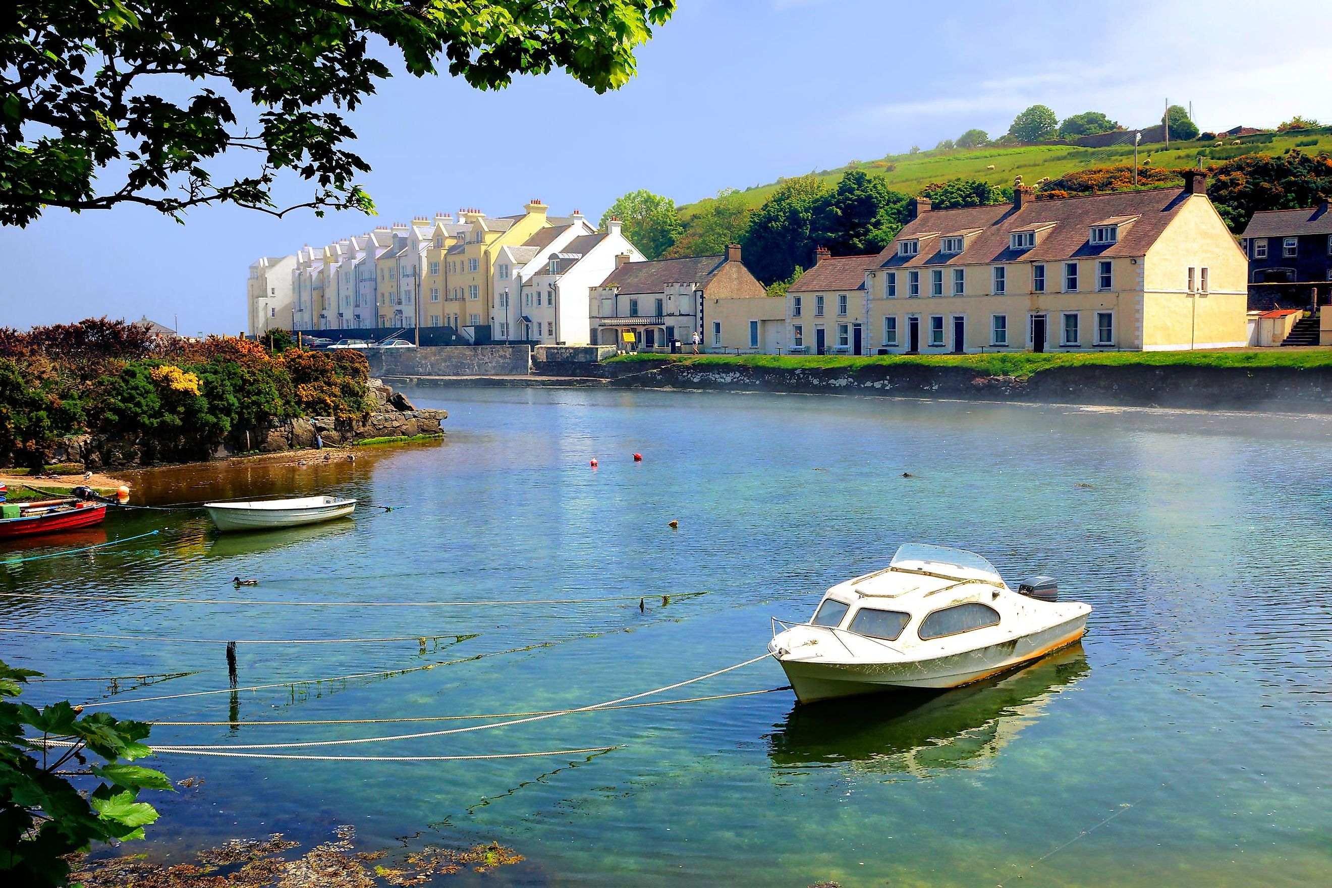 Picturesque harbor with fishing boat in the village of Cushendun, Antrim, Northern Ireland.