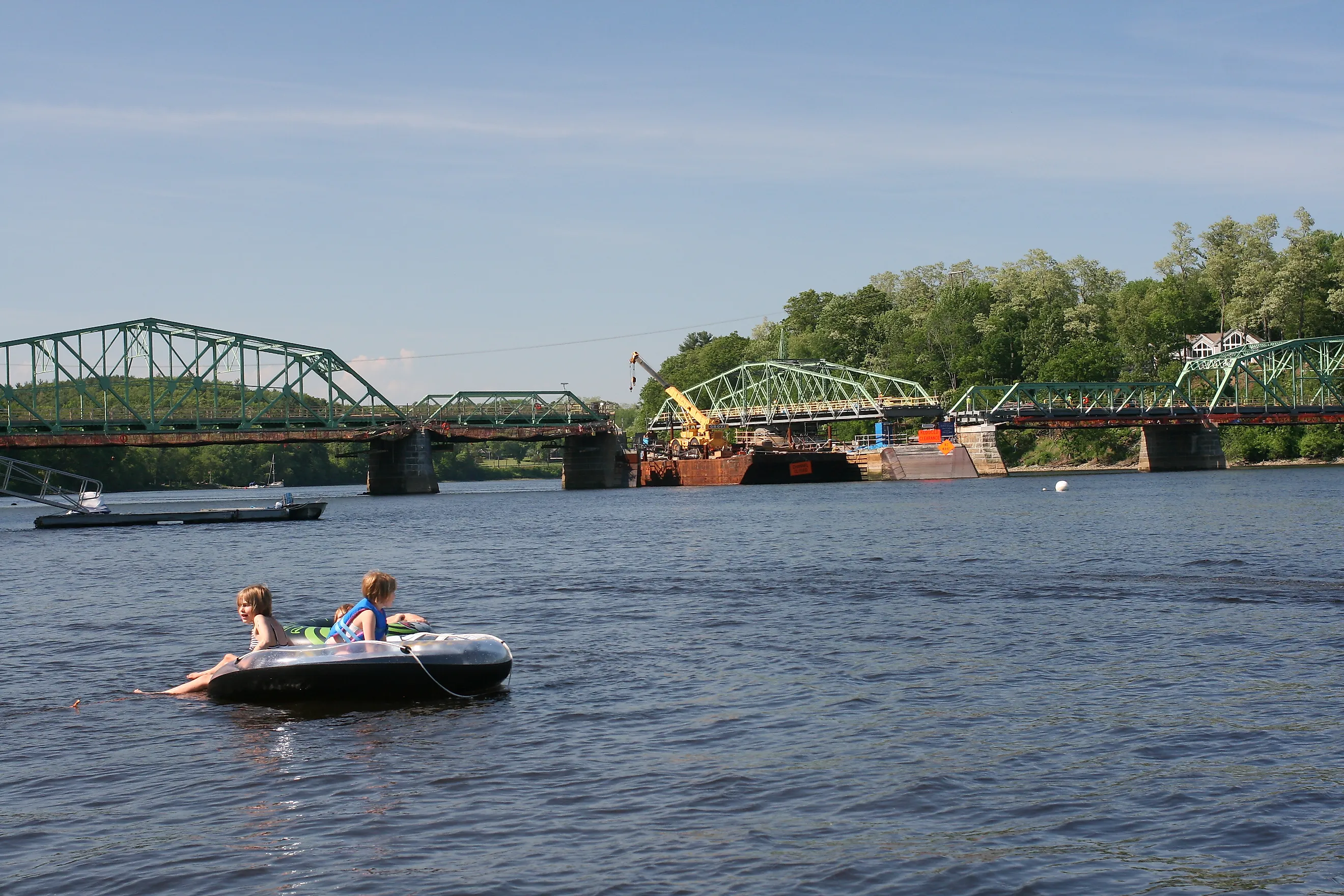 View from the river of the Rocks Village Bridge, which crosses the Merrimack River at West Newbury, Massachusetts, By kathryn from New York City - IMG_2014, By kathryn from New York City - IMG_2014, CC BY 2.0, https://commons.wikimedia.org/w/index.php?cur