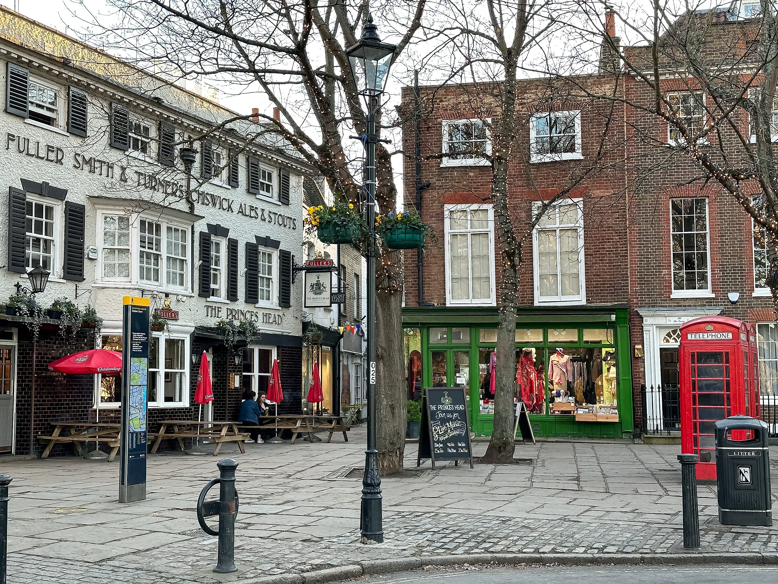 Richmond Upon Thames area, The Green view and The Prince's Head pub, West London, via Alla Tsyganova / Shutterstock.com