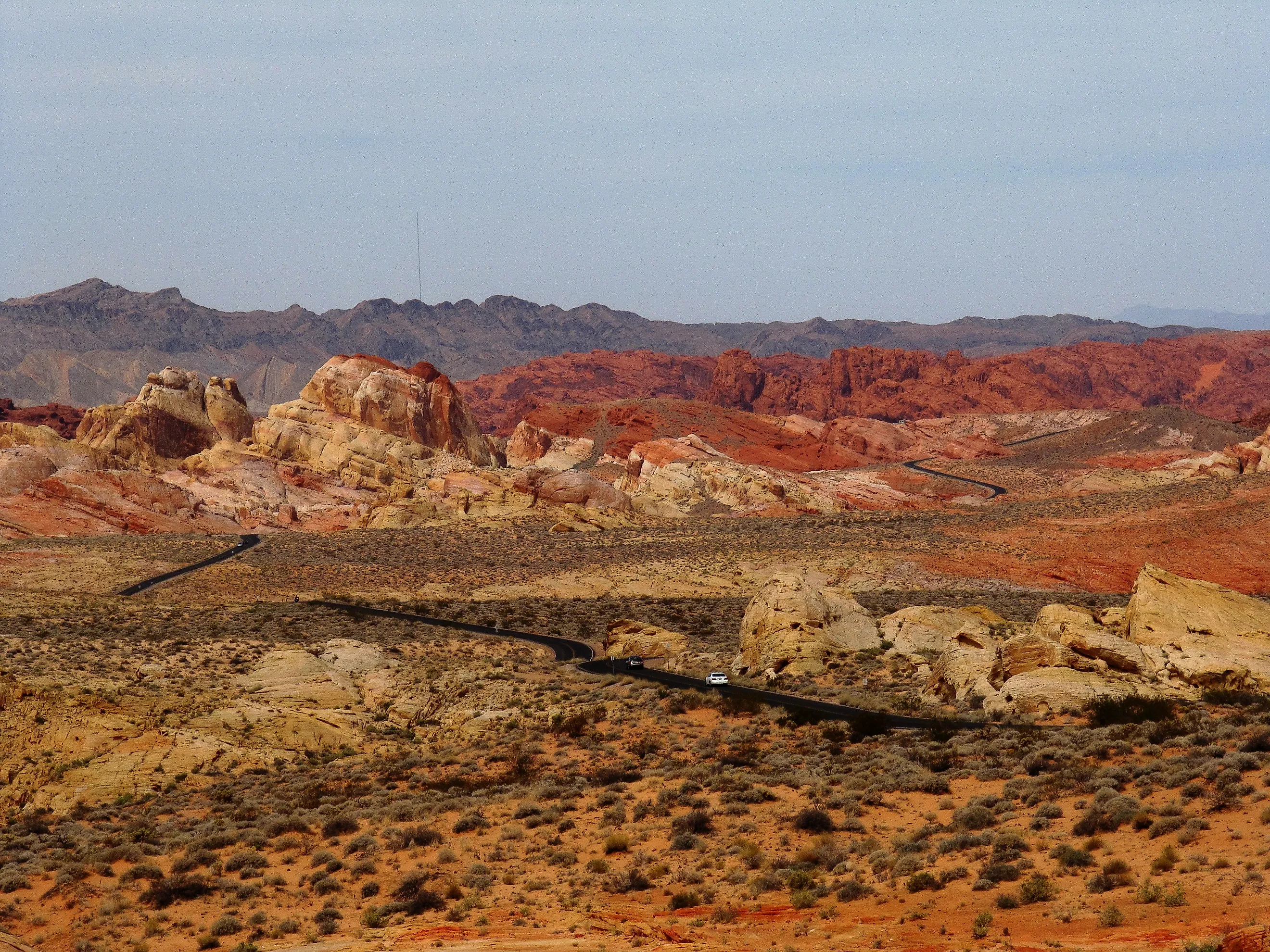 Road running through the otherworldly multicoloured, barren landscape of the Valley of Fire State Park, Nevada. 