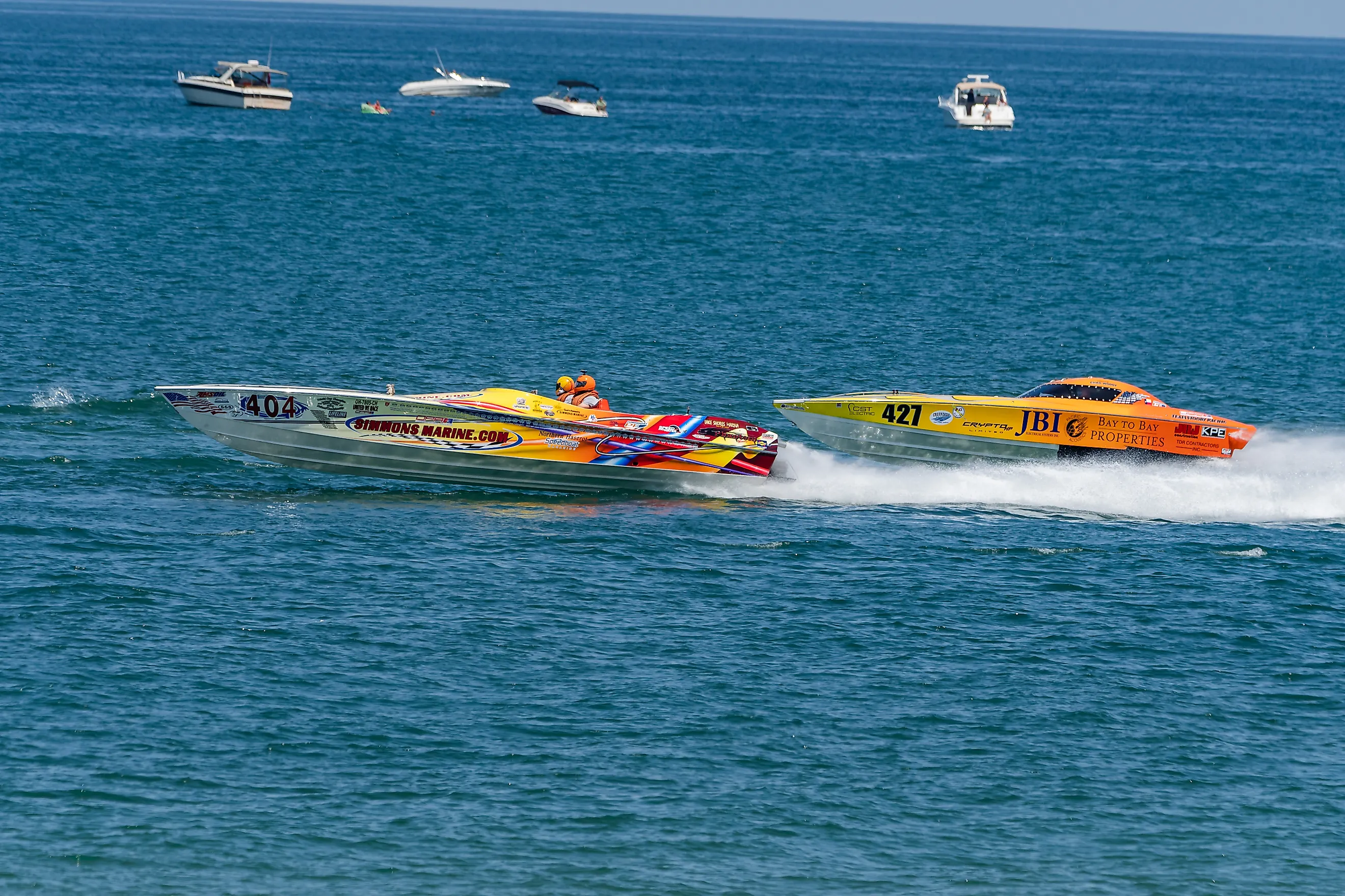 Power boat and helmeted recreators on Lake Michigan near Michigan City, Indiana. Image: Lewis Photo Studio - Shutterstock.