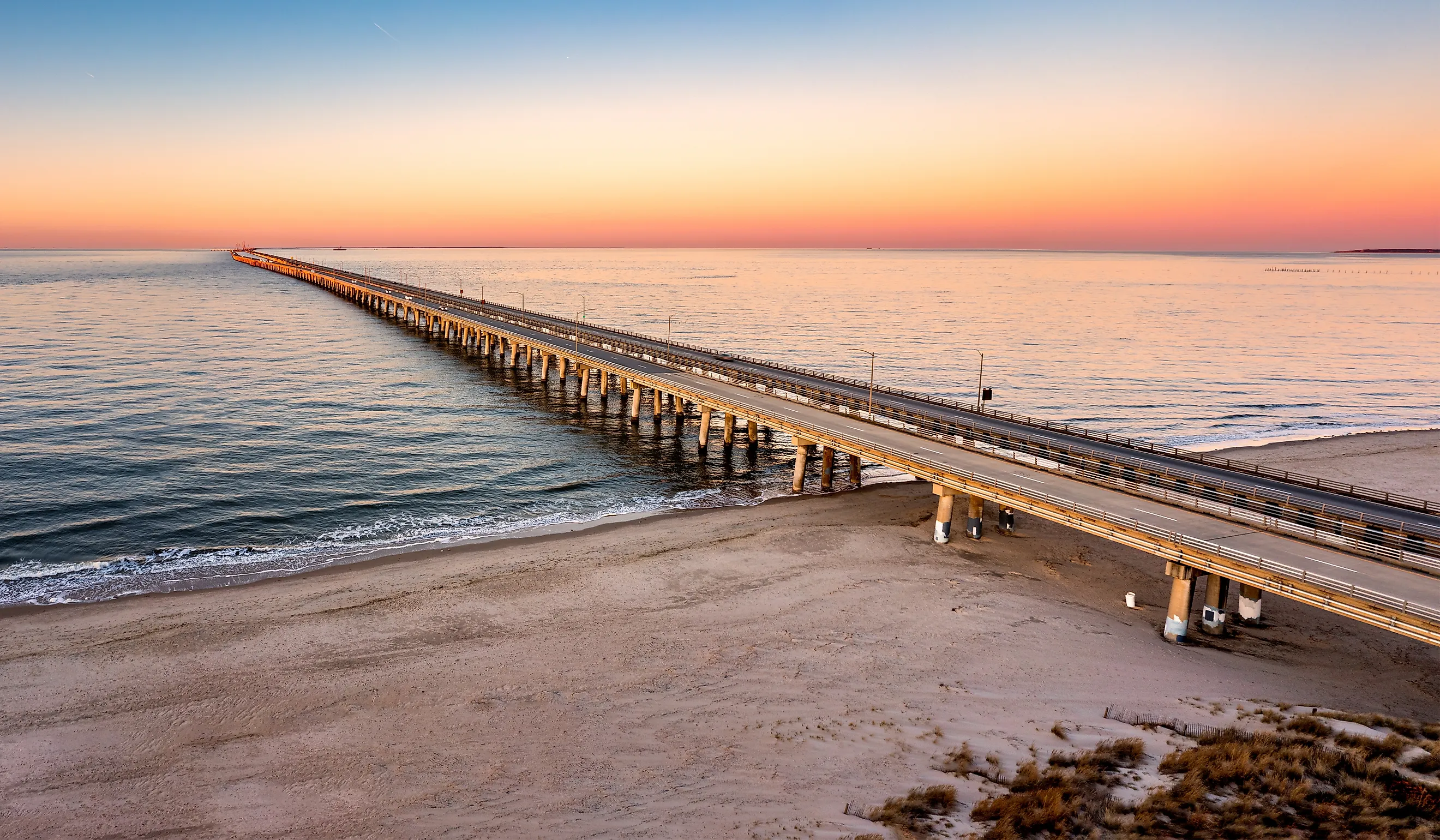 Aerial panorama of Chesapeake Bay Bridge Tunnel at sunset. 