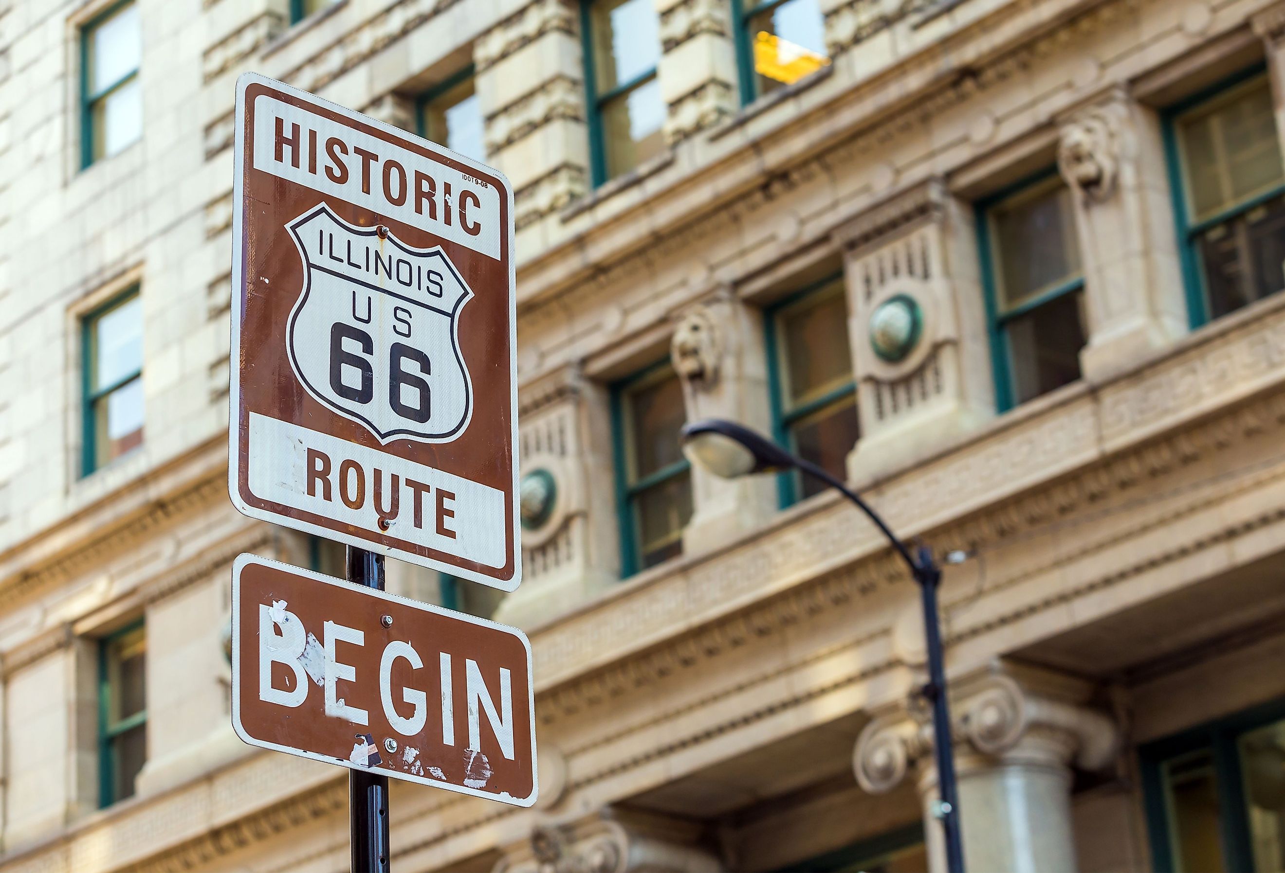 Route 66 sign, the beginning of historic Route 66, leading through Chicago, Illinois. Image credit f11photo via Shutterstock.