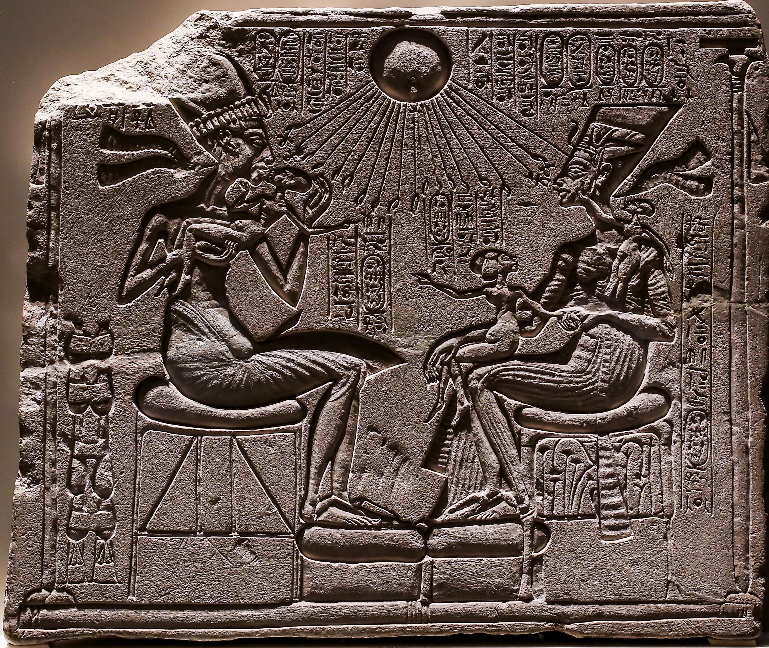Relief depicting Akhenaten and Nefertiti with three of their daughters under the rays of Aten.