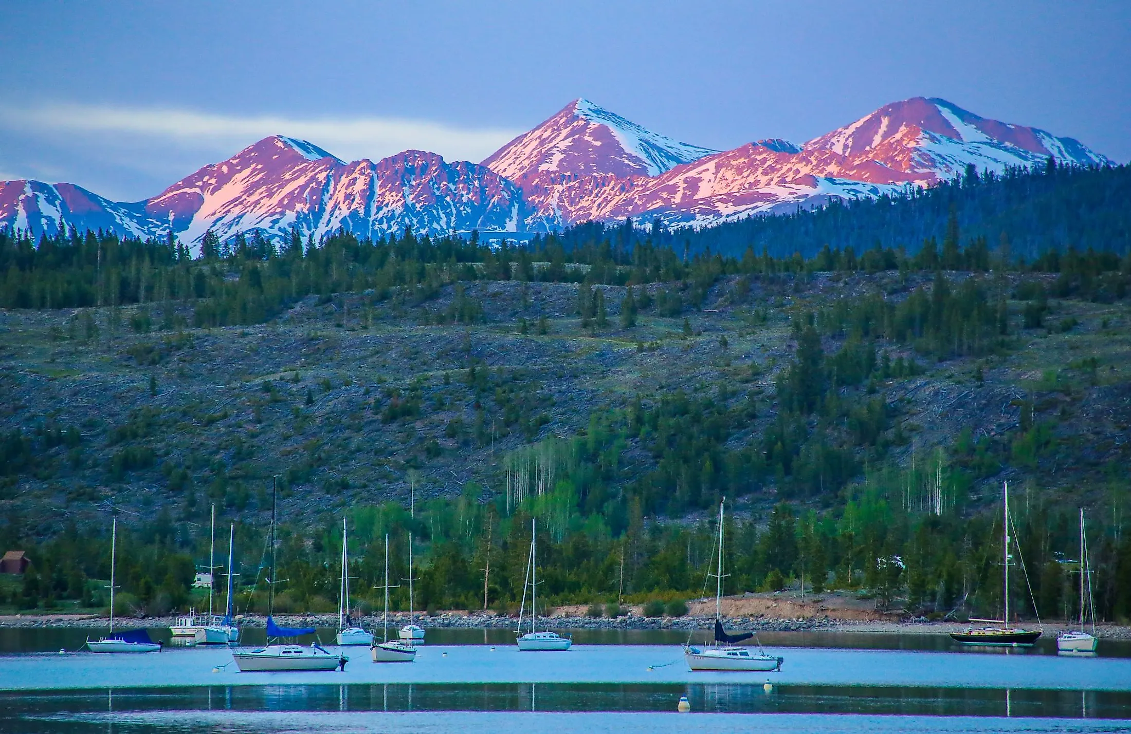 Alpenglow hitting the peaks of Grays and Torreys beyond the Frisco Bay Marina in Frisco, Colorado.